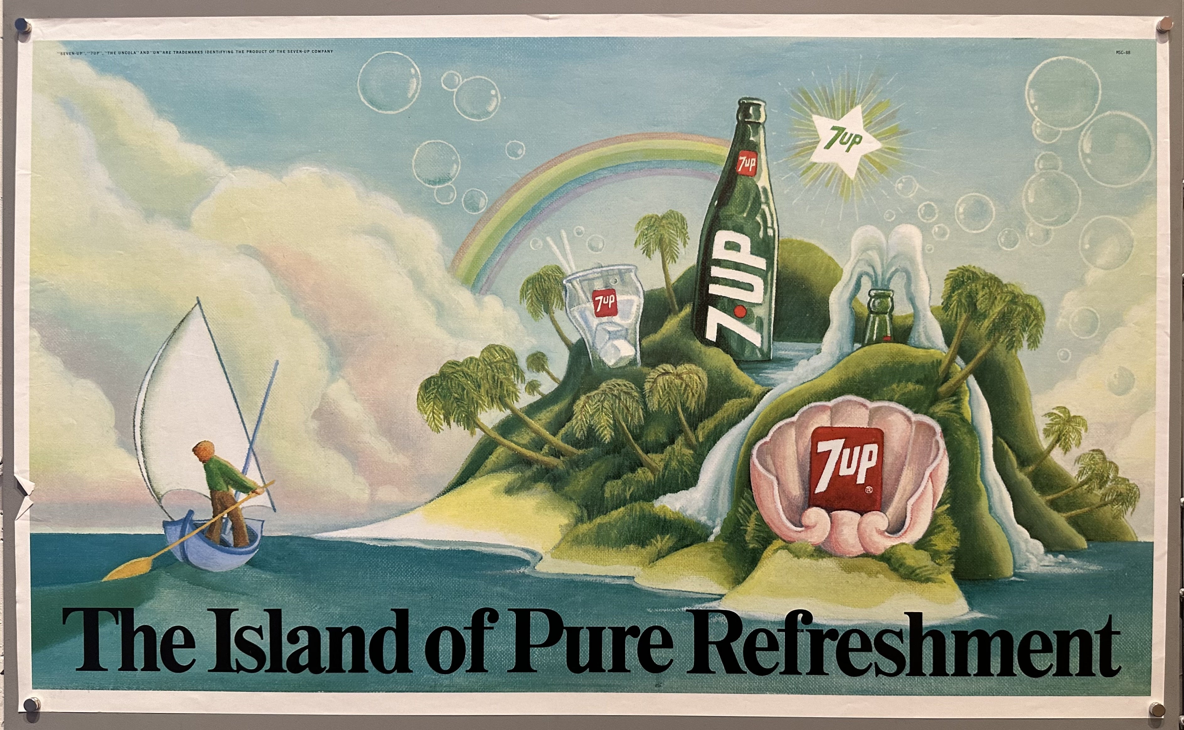 A man sails towards an island built upon 7UP products.