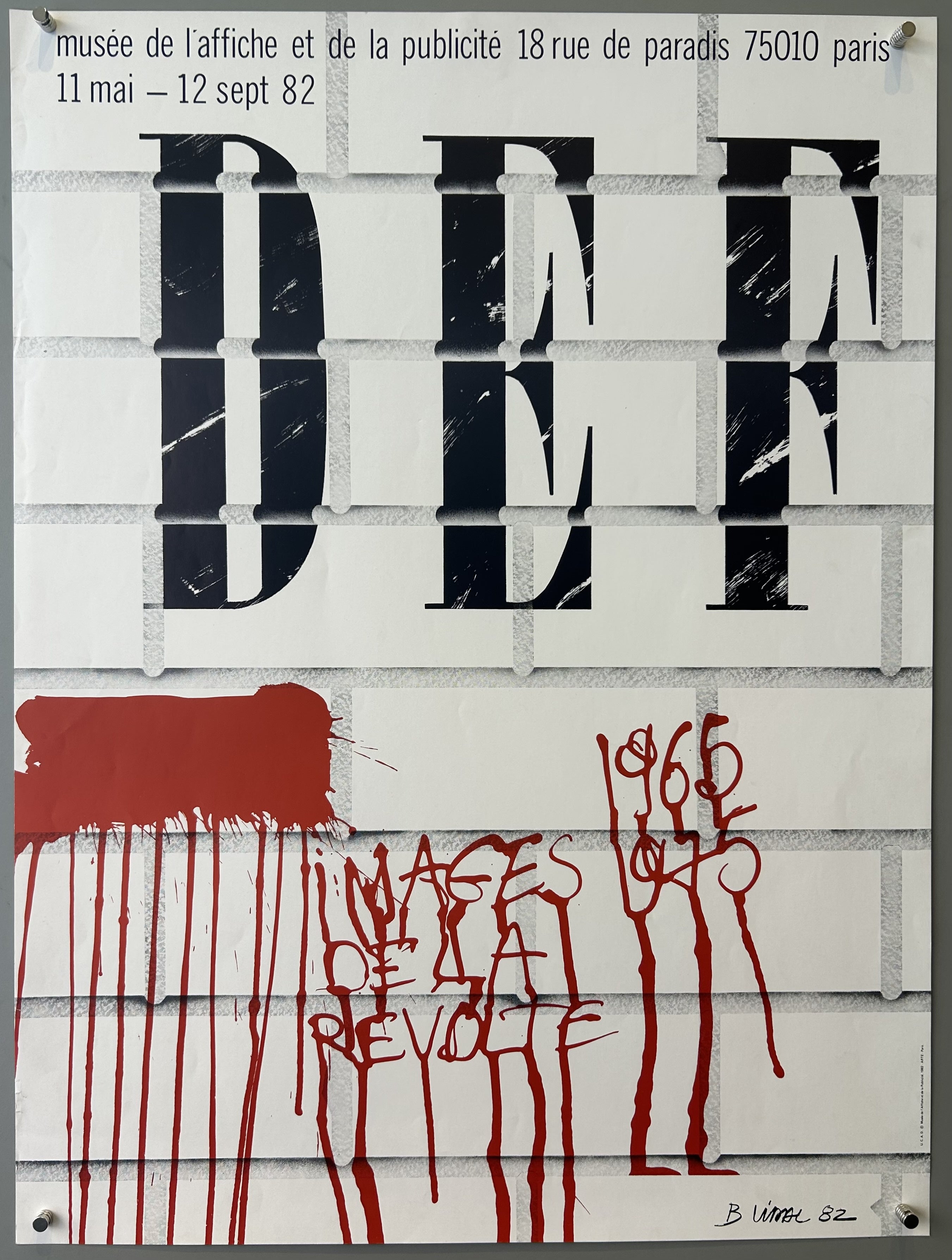 White brick background with black text; red text made to look like blood in bottom quadrant of poster.