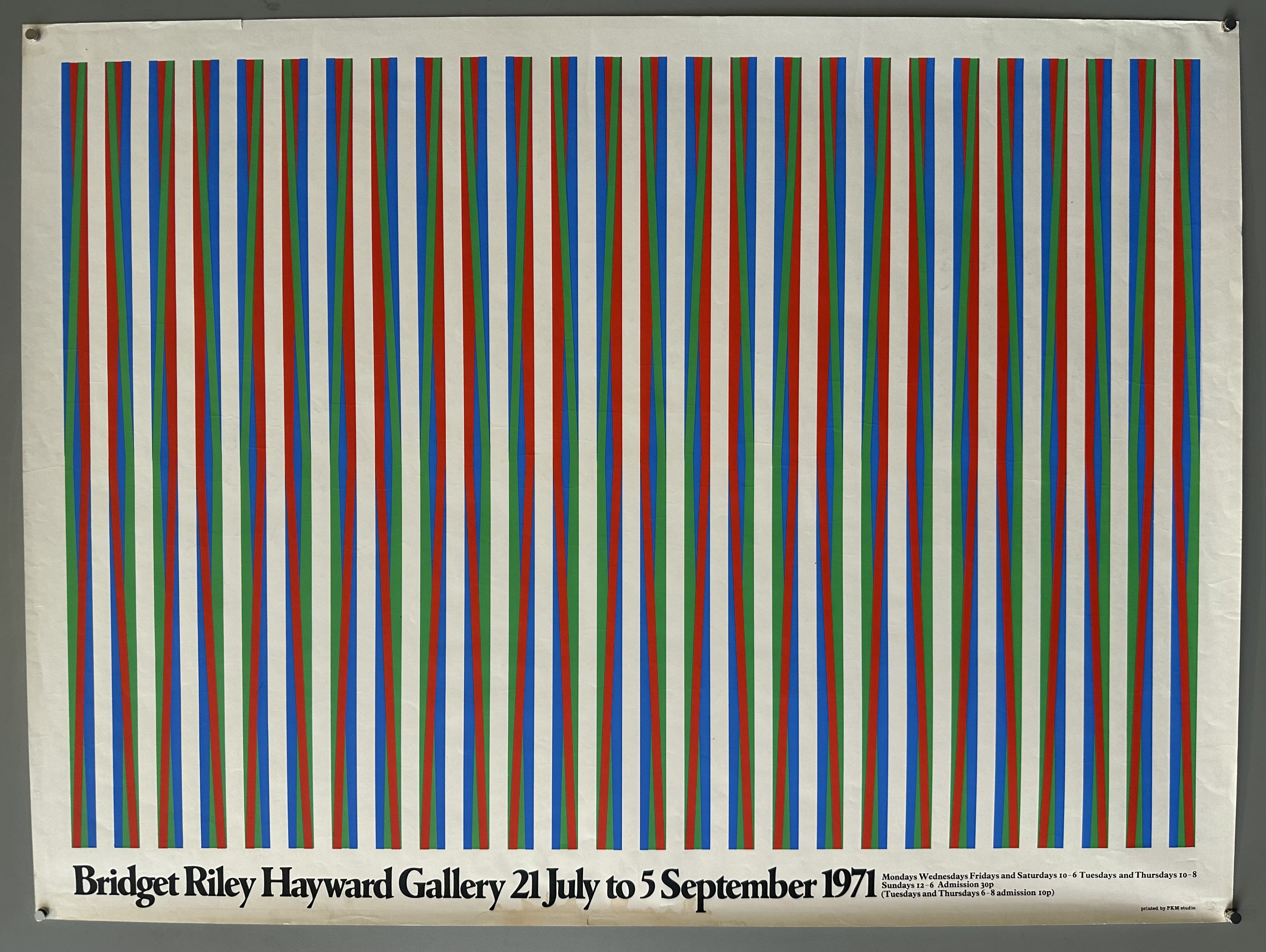 Horizontal oriented poster with stripes running vertically down and text along bottom in black.