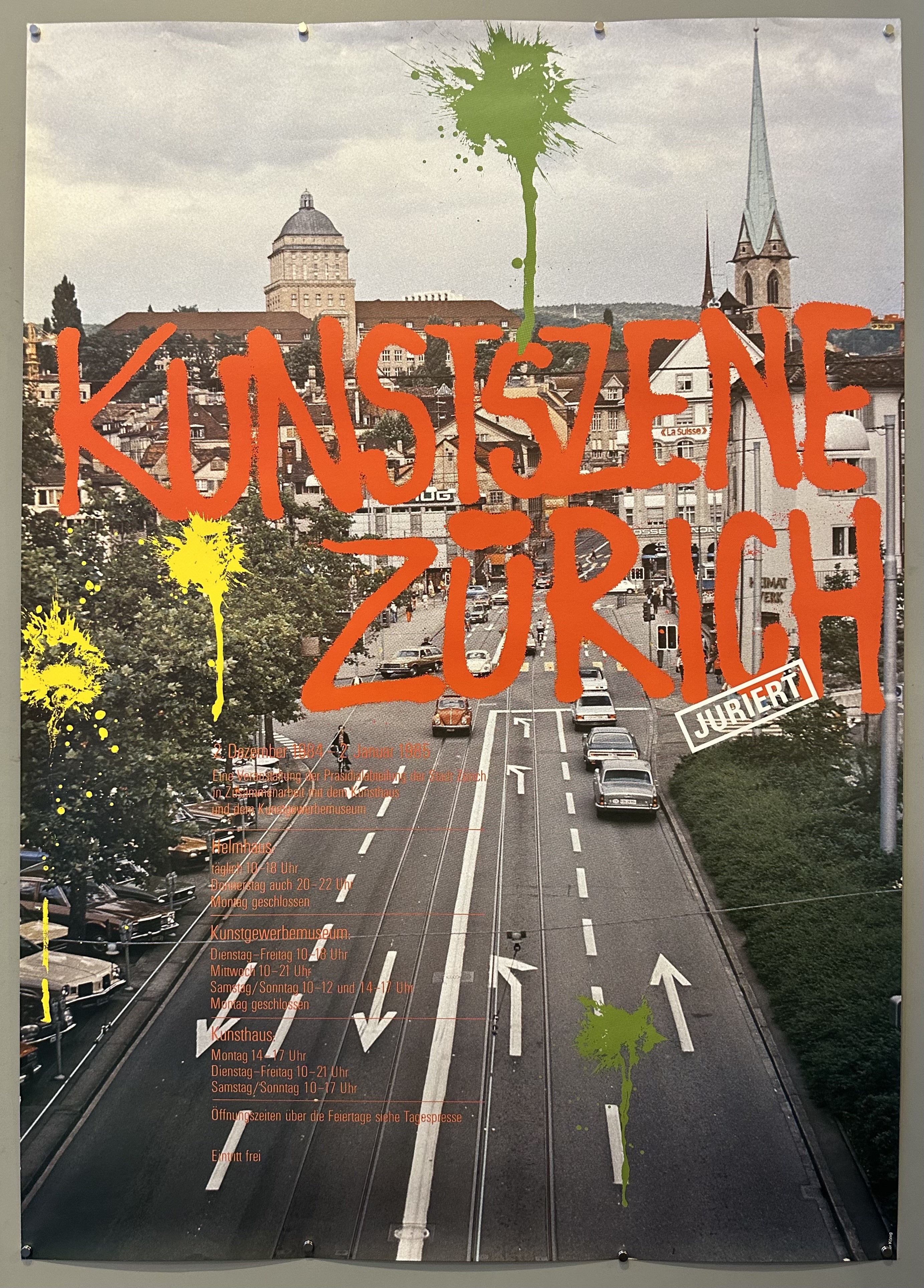 Graffiti style writing overlaid on a photograph of a street in Swiss exhibition poster.
