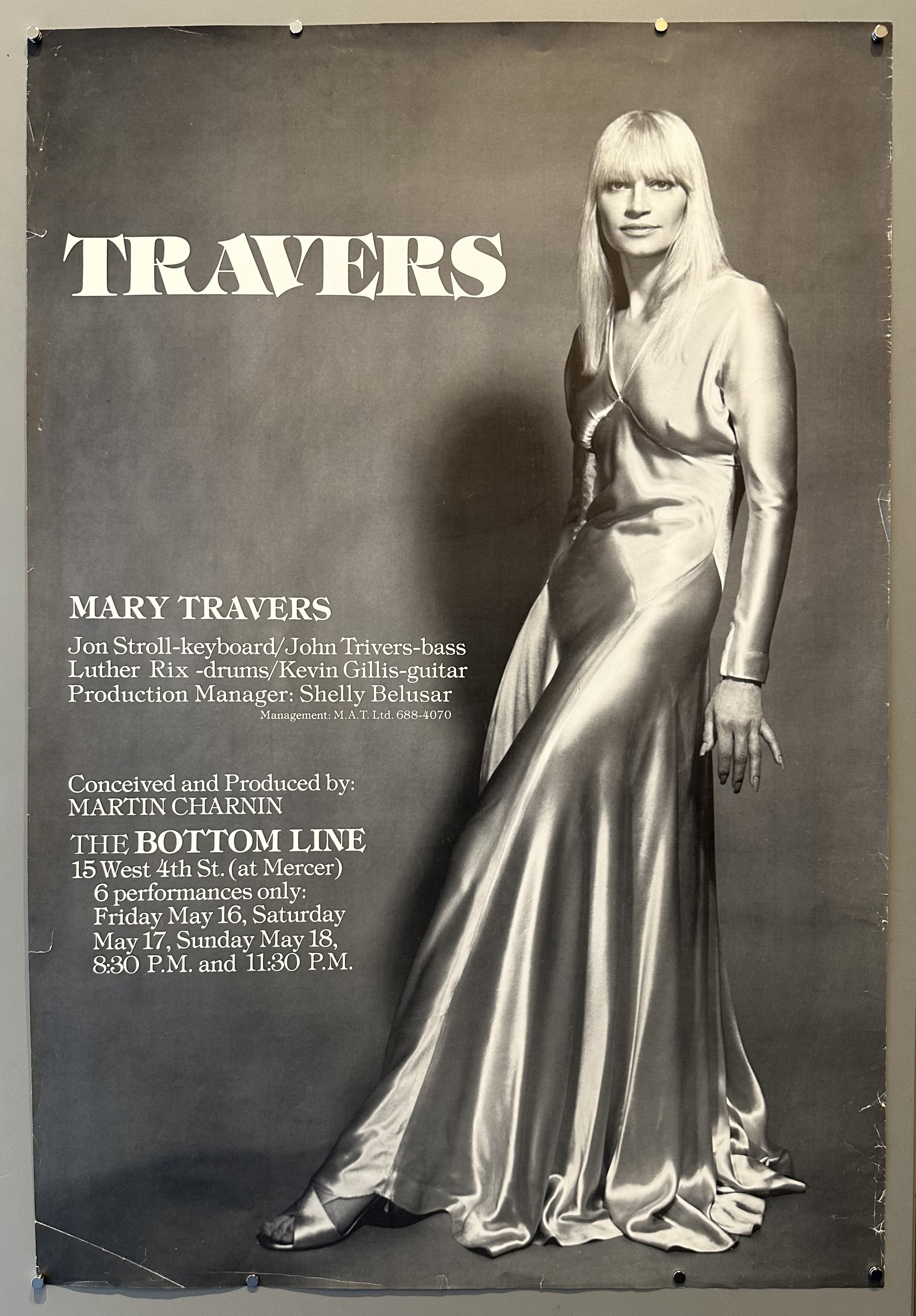 This is a promotional poster for Mary Travers's performances at "The Bottom Line" club in New York City. The poster prominently features a full-length image of Mary Travers, wearing a long, flowing gown.