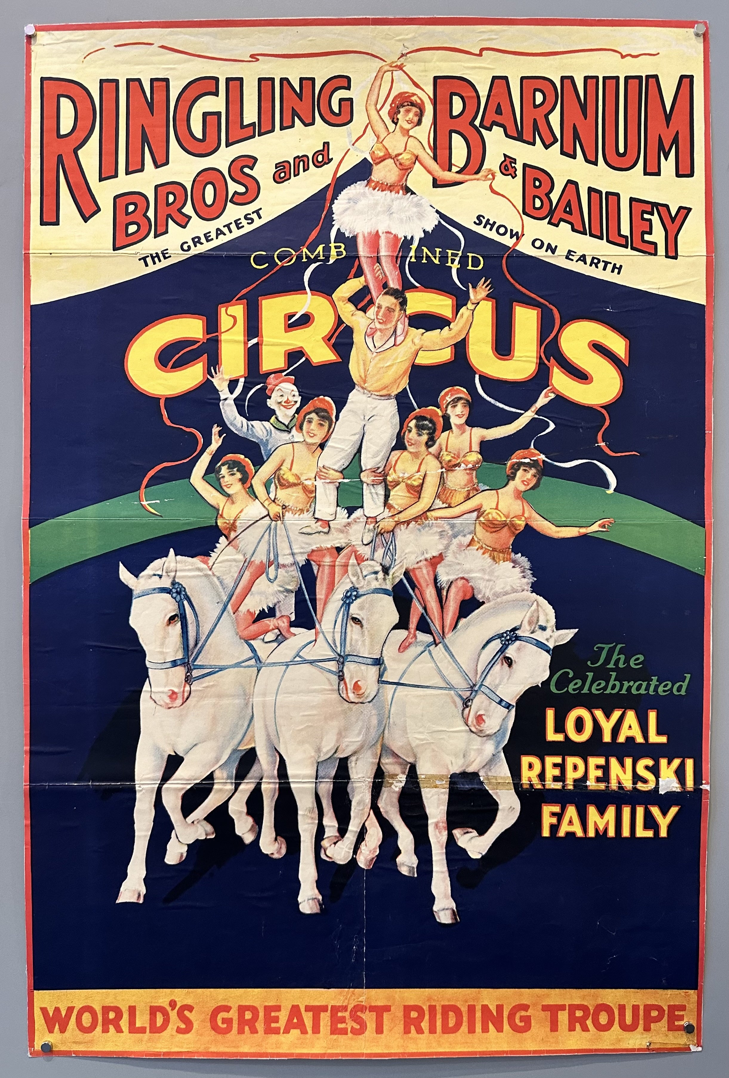 A vintage circus poster for the Ringling Brothers and Barnum & Bailey Circus featuring the Loyal Repenski Family, the world's greatest riding troupe. The poster features a group of performers in elaborate costumes on horseback, the words "The Greatest Show on Earth" is prominently displayed.