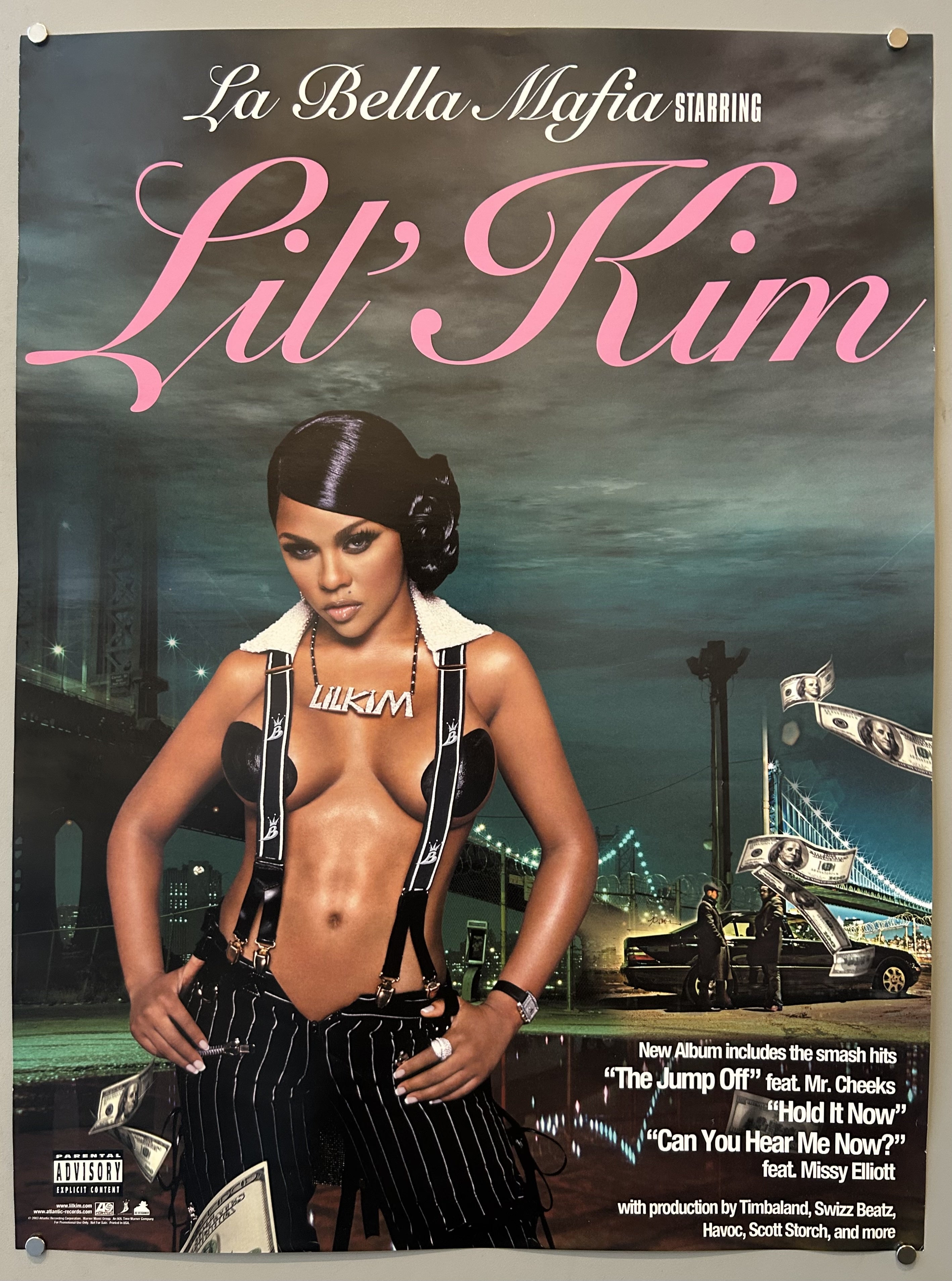 woman stands in front of bridge