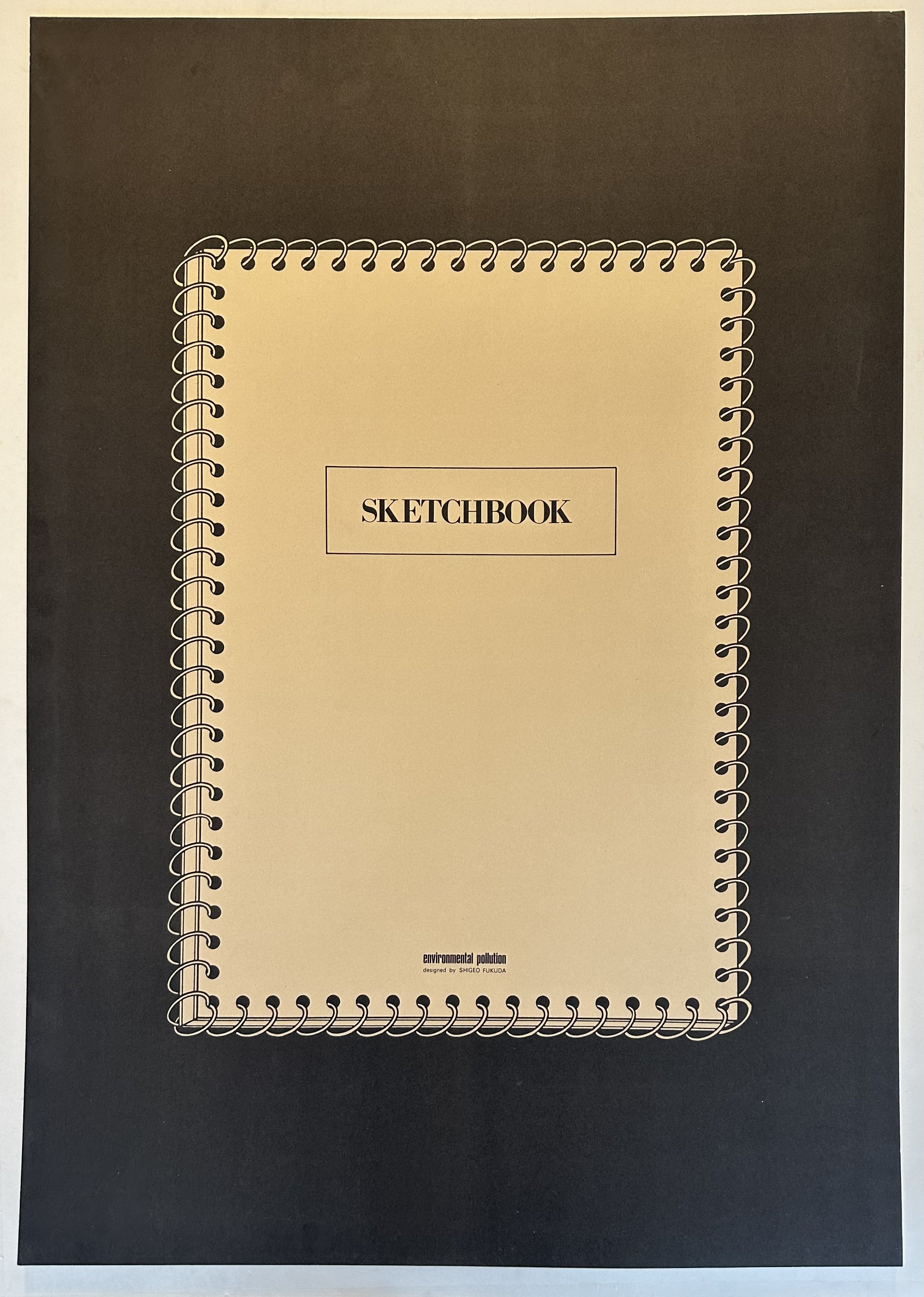 The sketchbook has a spiral binding on all sides and the word "SKETCHBOOK" is written in uppercase letters in the upper center of the book.