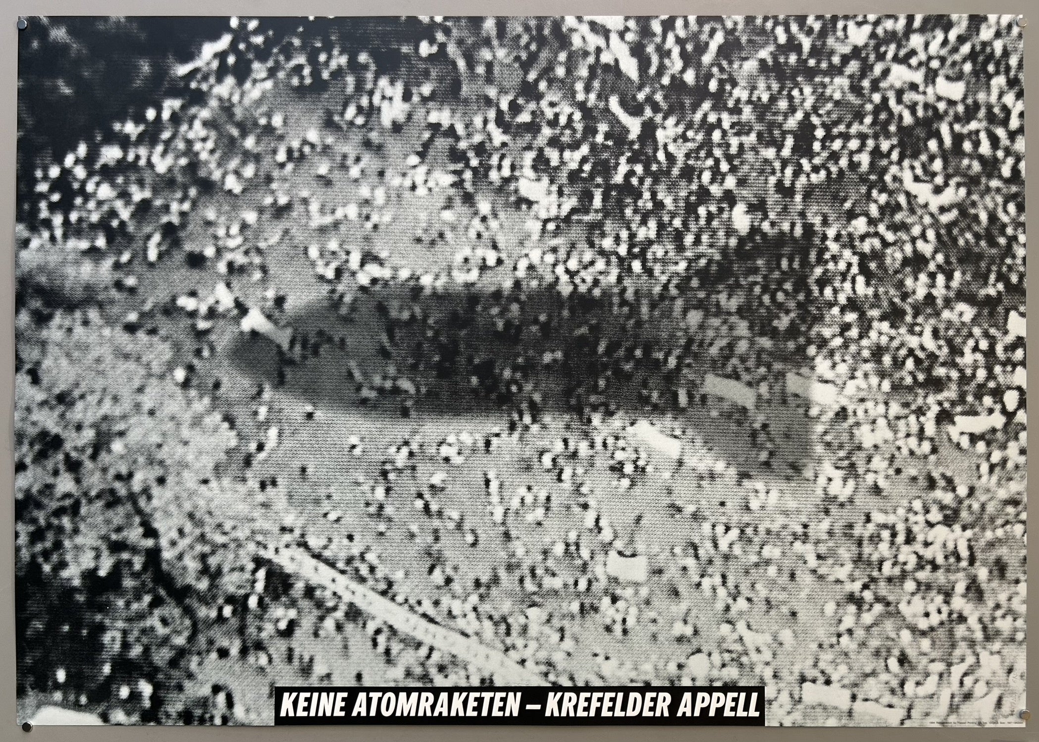 The poster was created in 1982 by Frieder Grindler and is part of "The 100 best posters from Europe and the United States / 1945-1990" collection. It is associated with the Krefeld Appeal, a significant anti-nuclear weapons movement in West Germany during the early 1980s, which protested against the deployment of new nuclear missiles in Europe.