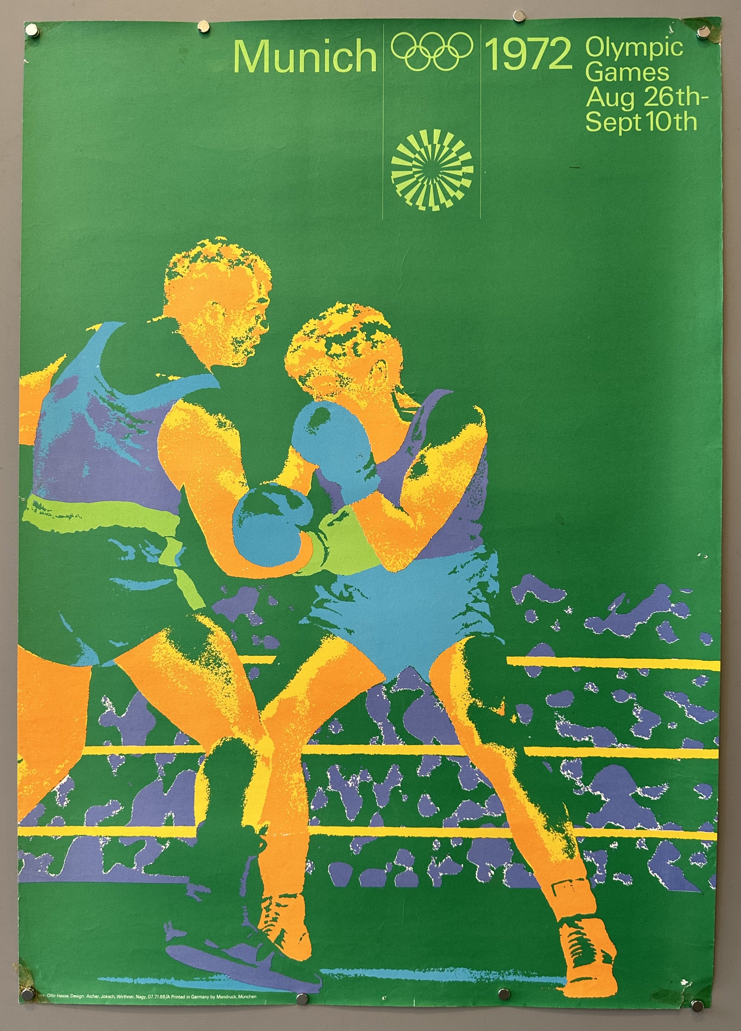 1972 Olympics poster design by Otl Aicher featuring green inverted photograph of two boxers in the ring.
