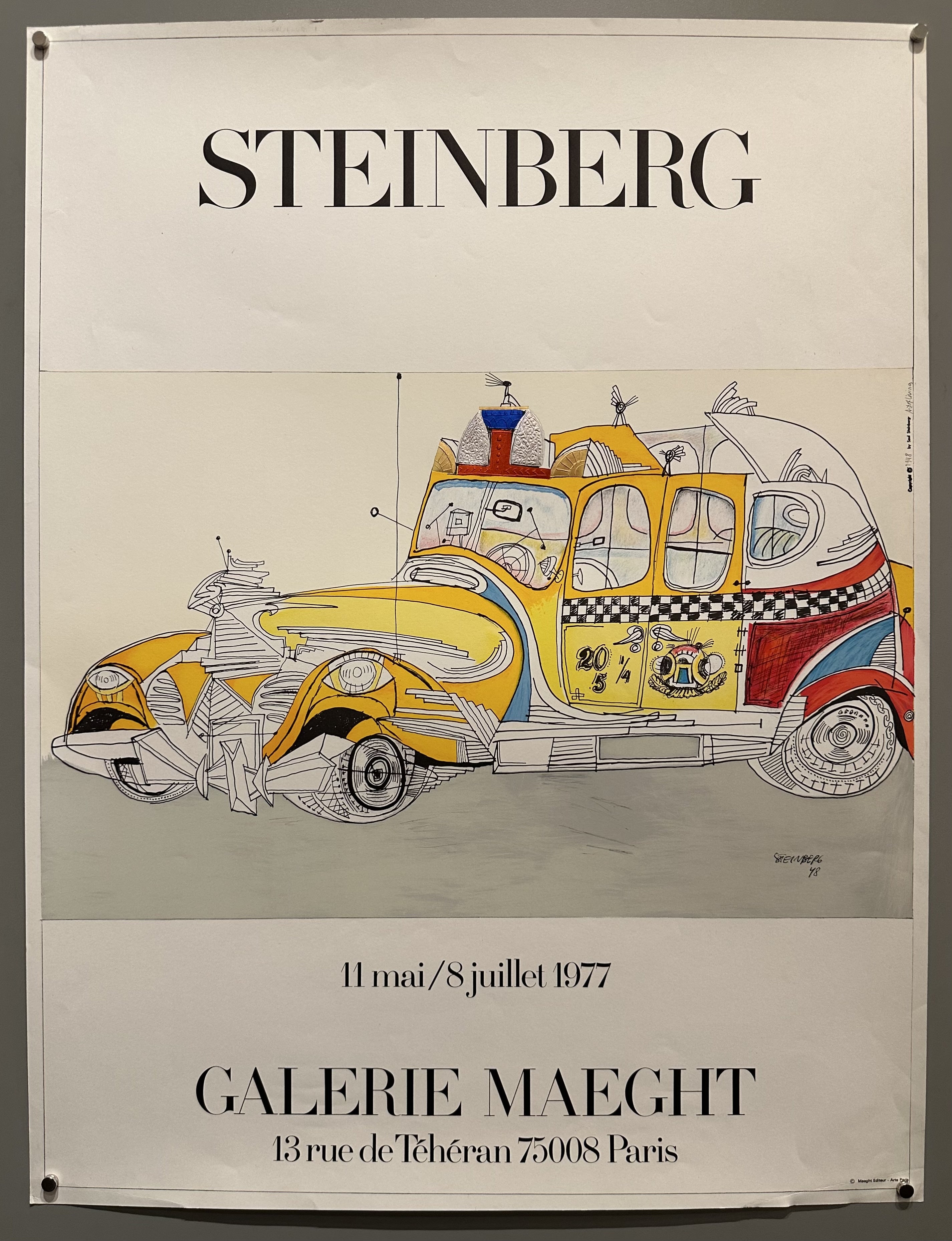 A cartoon taxi by Steinberg is in the middle of the poster to promote an art exhibition of his work in France.