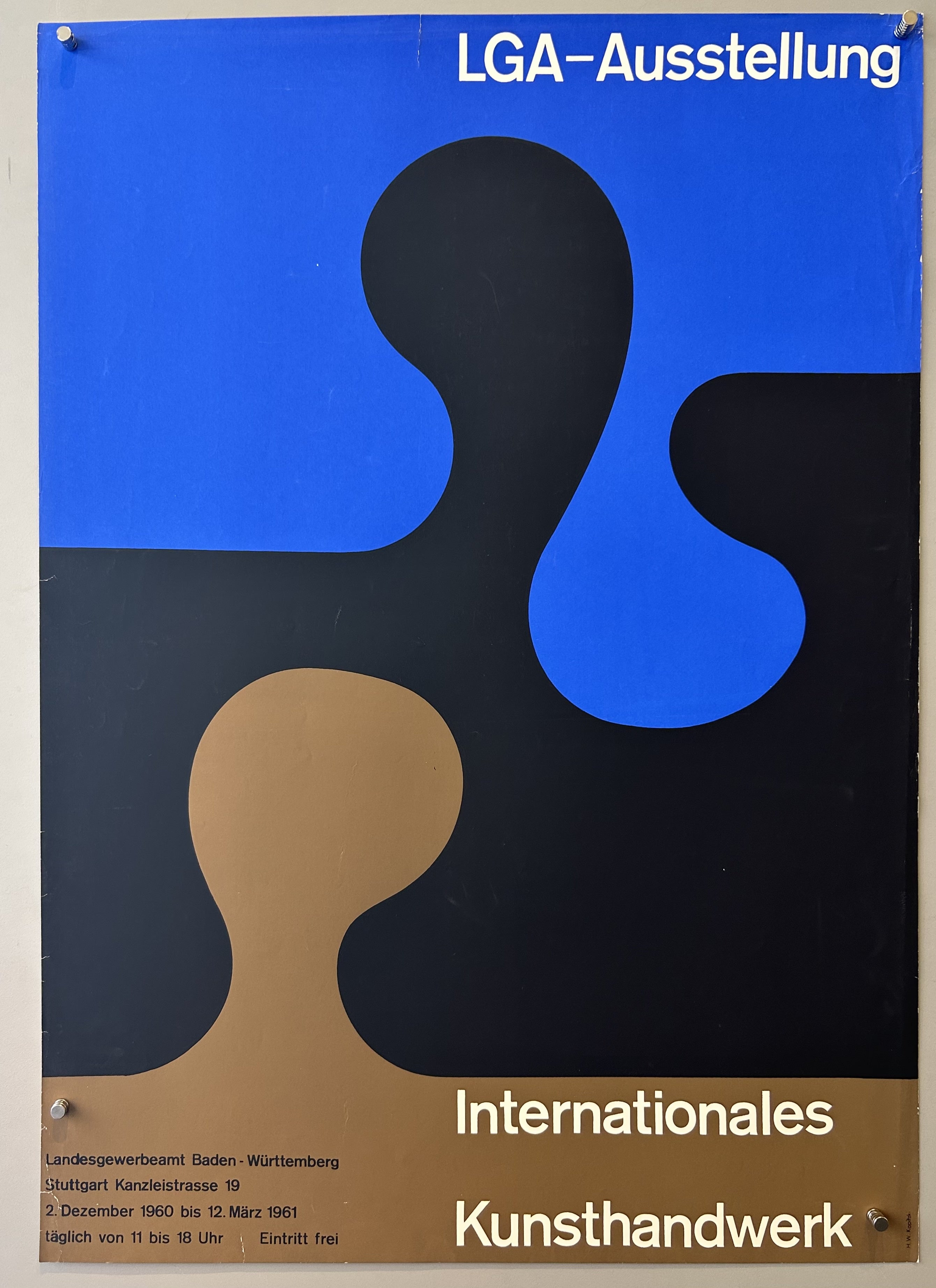Blue, black and brown puzzle pieces take up entirety of poster as background with white text along top and bottom.