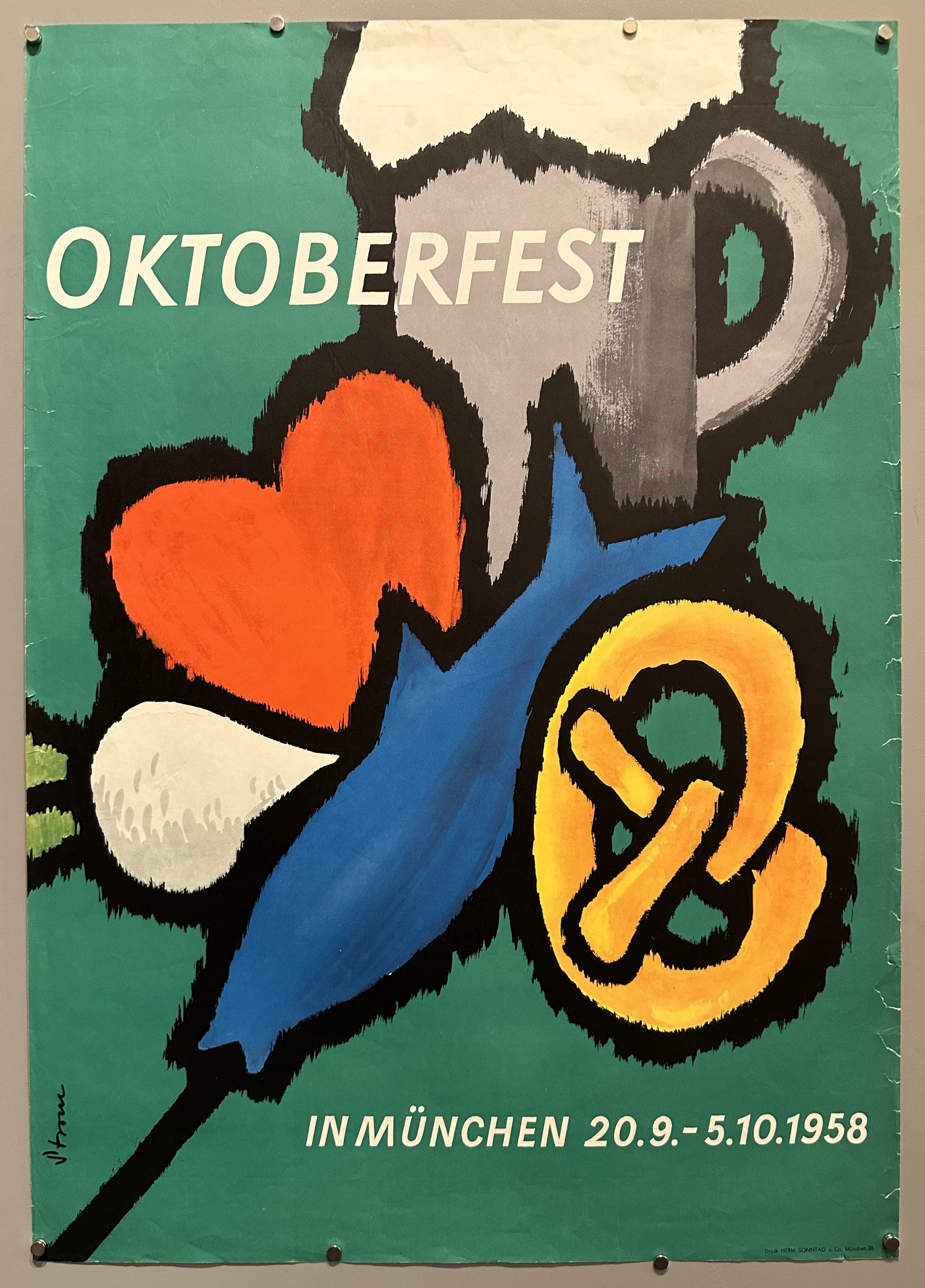 Green poster with drawings of different Octoberfest-themed items.