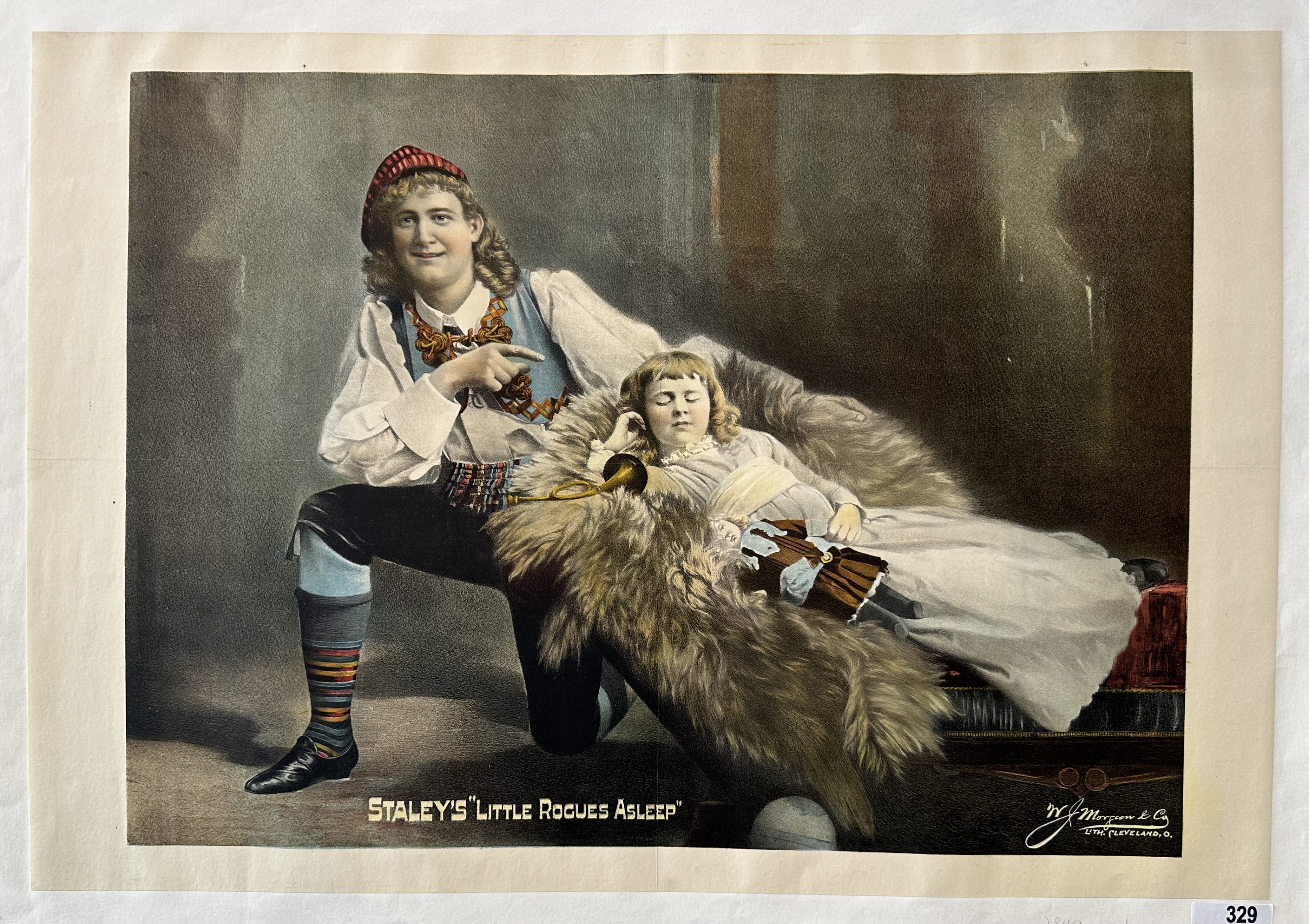 man pointing at a girl as she sleeps holding a doll, behind them is a dark background.