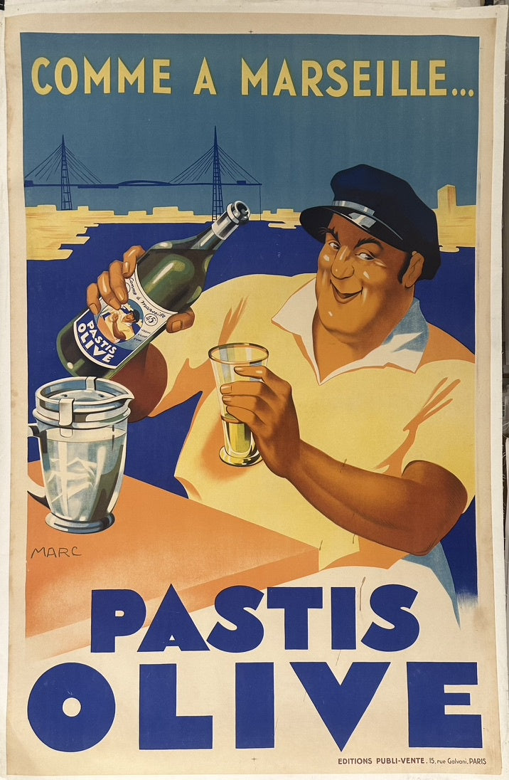 It features a cheerful mariner preparing a glass of pastis, set against the backdrop of the Port of Marseille, with the iconic Transporter Bridge visible in the background