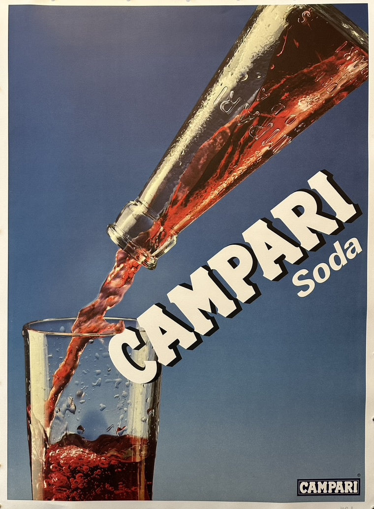 Campari Soda being poured into a glass against a blue background, with bold white text reading "CAMPARI Soda."