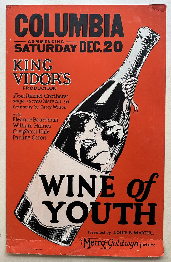 This is a poster for the 1924 silent film "Wine of Youth", directed by King Vidor and produced by Metro-Goldwyn-Mayer. It features a striking image of a wine bottle with a couple embracing inside, likely representing the themes of love and youthful exuberance