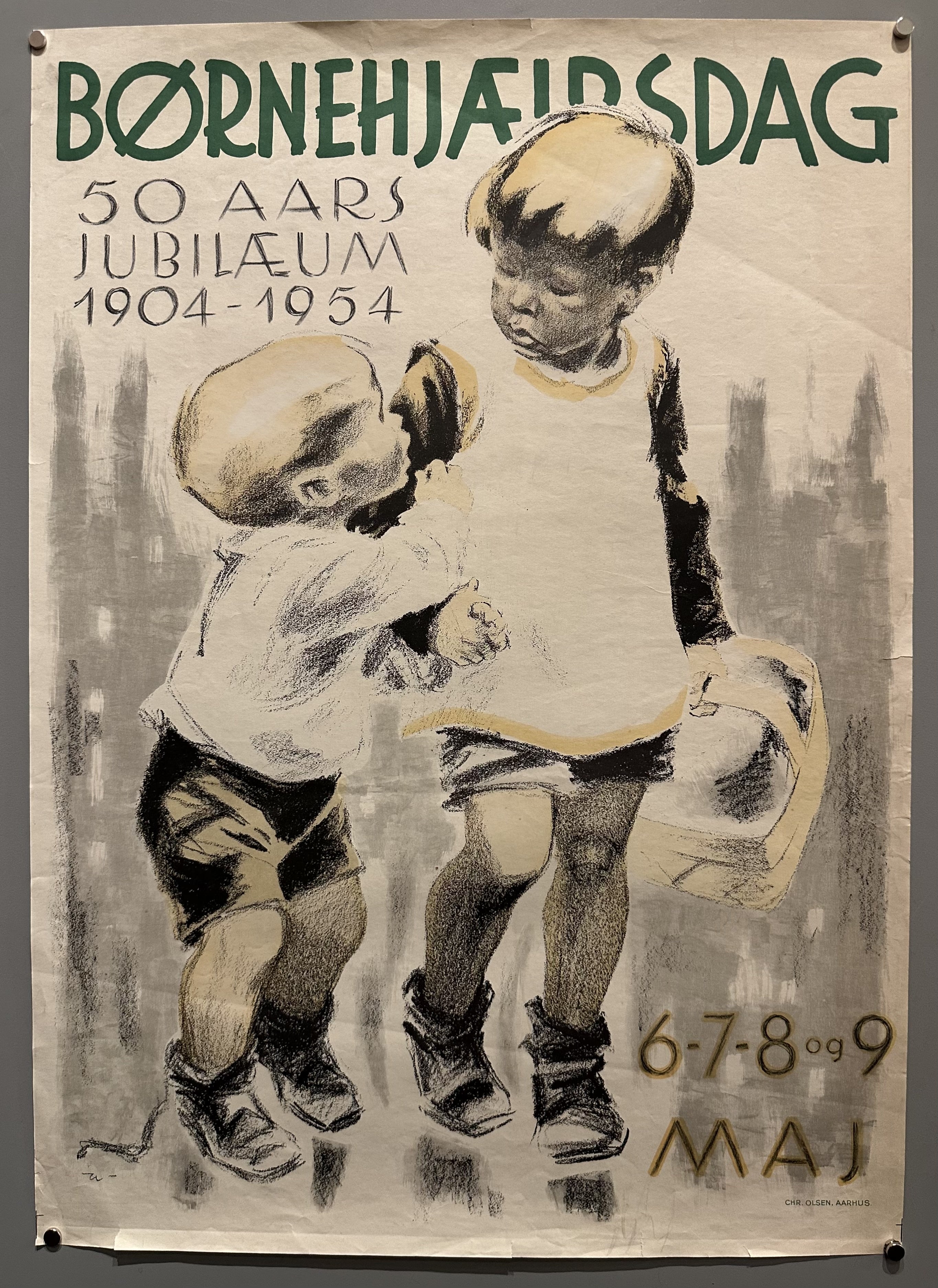 Two children walk hand-in-hand to celebrate the 50th Anniversary of Children's Aid Day.