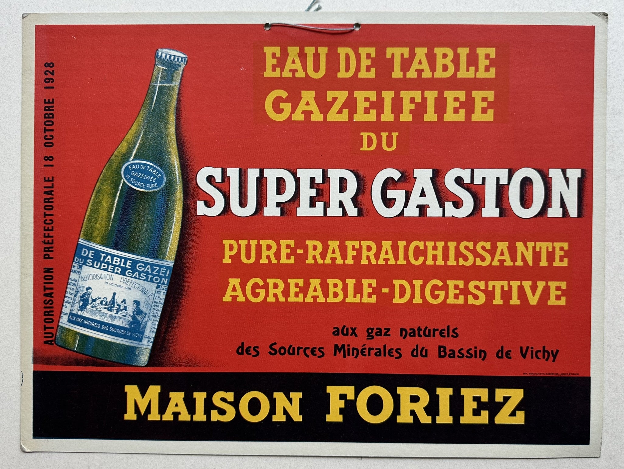 This vintage poster advertises "Eau de Table Gazeifiee du Super Gaston," a sparkling table water, from Maison Foriez. It features a green bottle with a label, set against a red background with white and yellow text.