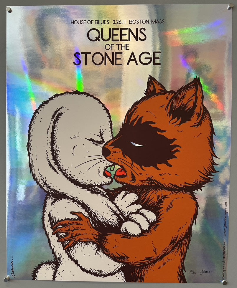 A holographic concert poster for Queens of the Stone Age, featuring an illustration of a white rabbit-like creature embracing and seemingly kissing a reddish-brown raccoon-like creature