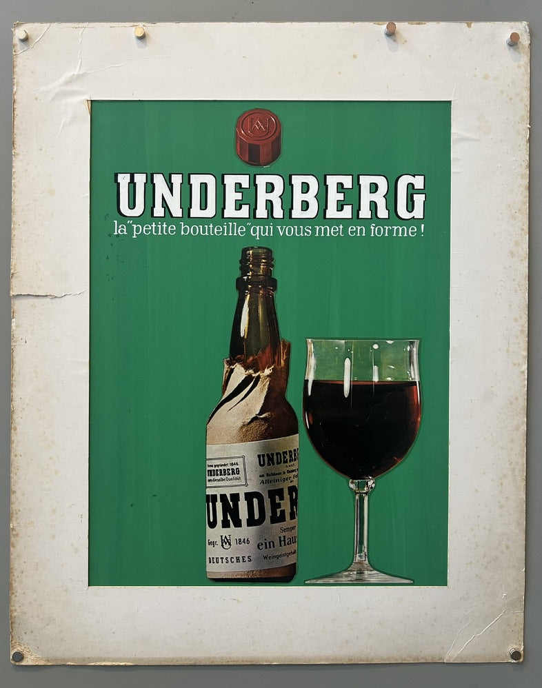 This poster advertises Underberg, a German herbal digestive bitter. It features a bottle of Underberg with its signature straw paper wrapping, and a glass of the dark liquid on the right side. The text says "UNDERBERG la petite bouteille qui vous met en forme!", which translates to "the little bottle that gets you in shape!"