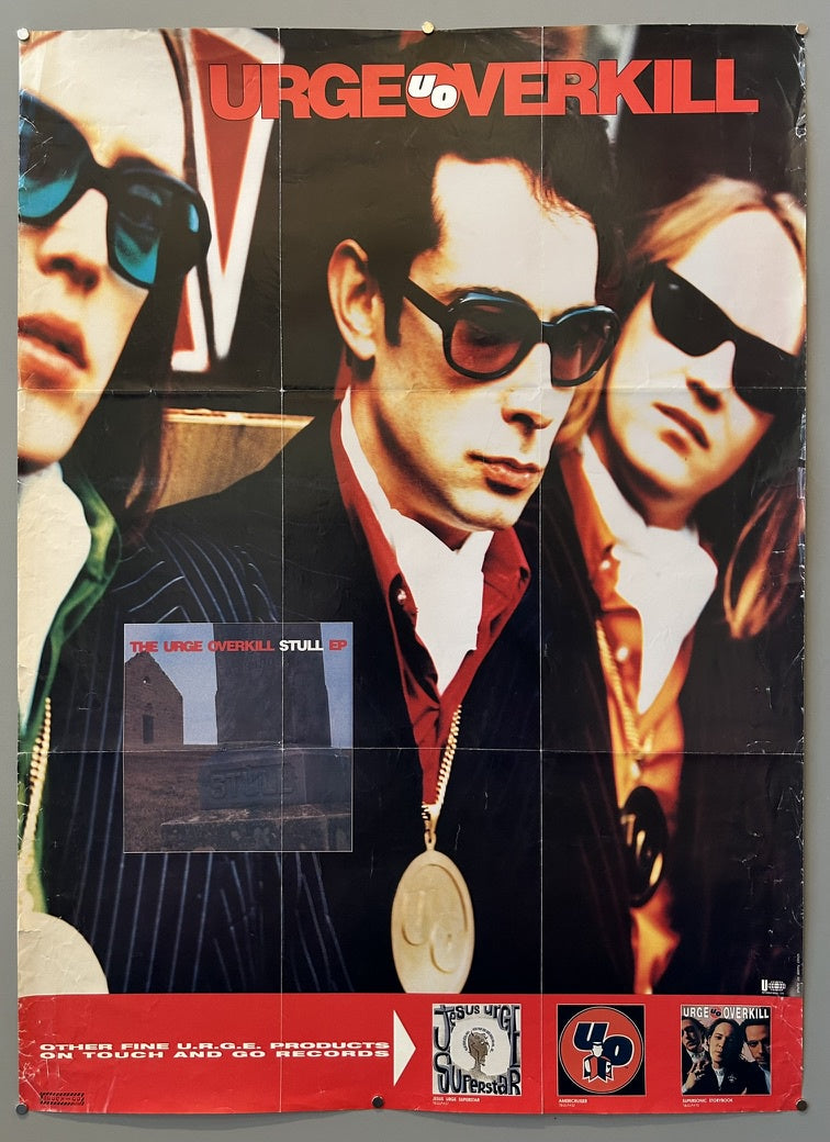 Urge Overkill, featuring three band members in sunglasses with the band's name "URGEOVERKILL" prominently displayed at the top.