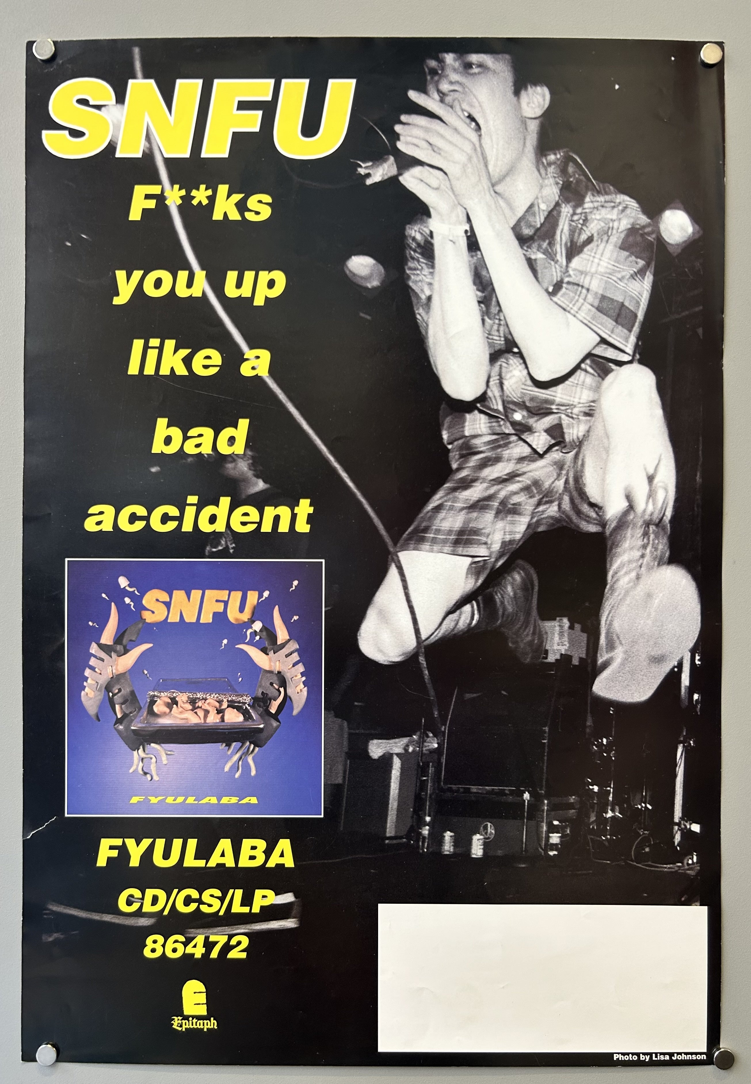 SNFU is a Canadian punk band, and Epitaph Records is an American independent record label based in Los Angeles, California. The poster promotes the album's availability on CD, CS (cassette), and LP (vinyl record).