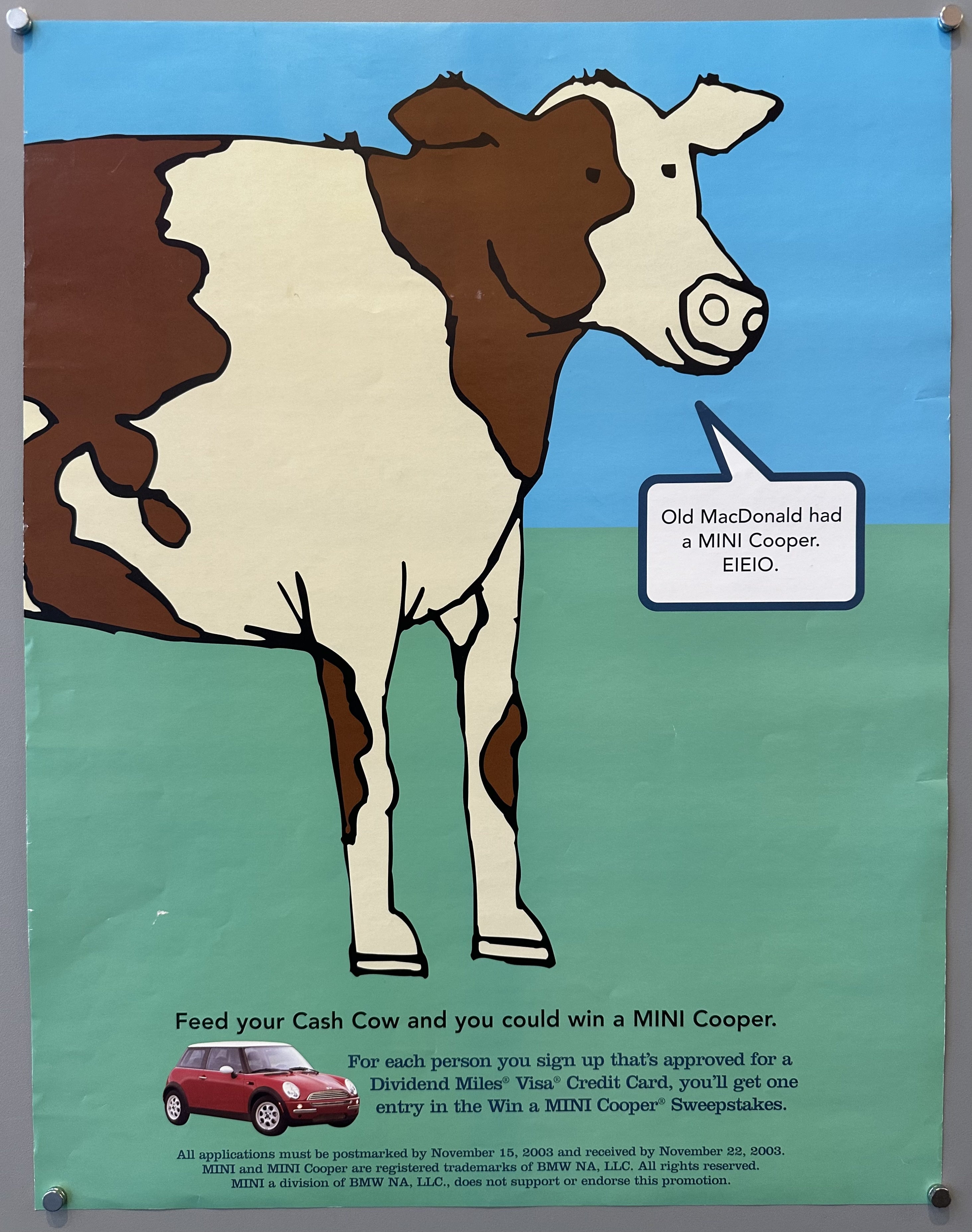 Cartoon cow speaking about the Mini Cooper sweepstakes with blue sky and green gras