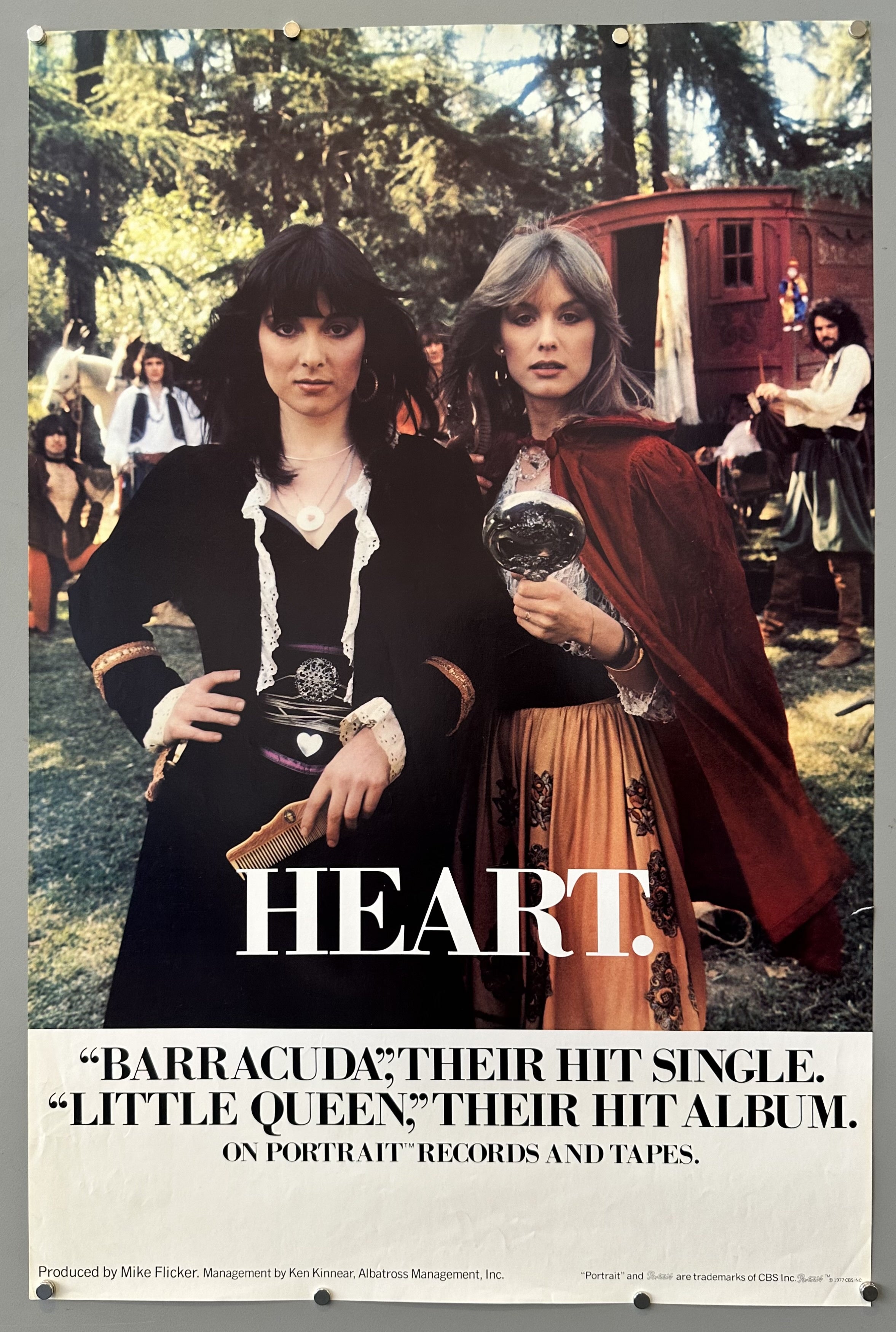 Members of band Heart pose for album cover with white border and black text underneath photo.