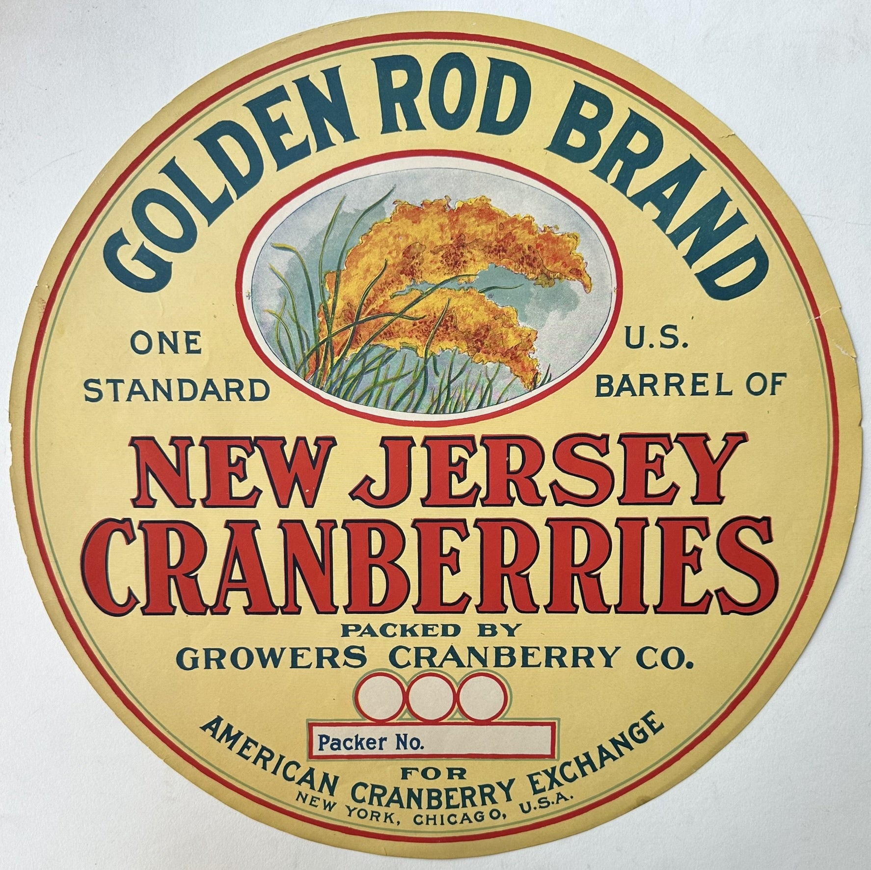 A vintage, circular Golden Rod Brand label for New Jersey Cranberries, featuring text: "GOLDEN ROD BRAND," "ONE STANDARD U.S. BARREL OF NEW JERSEY CRANBERRIES," "PACKED BY GROWERS CRANBERRY CO." with a space for "Packer No." and "FOR AMERICAN CRANBERRY EXCHANGE NEW YORK, CHICAGO, U.S.A.