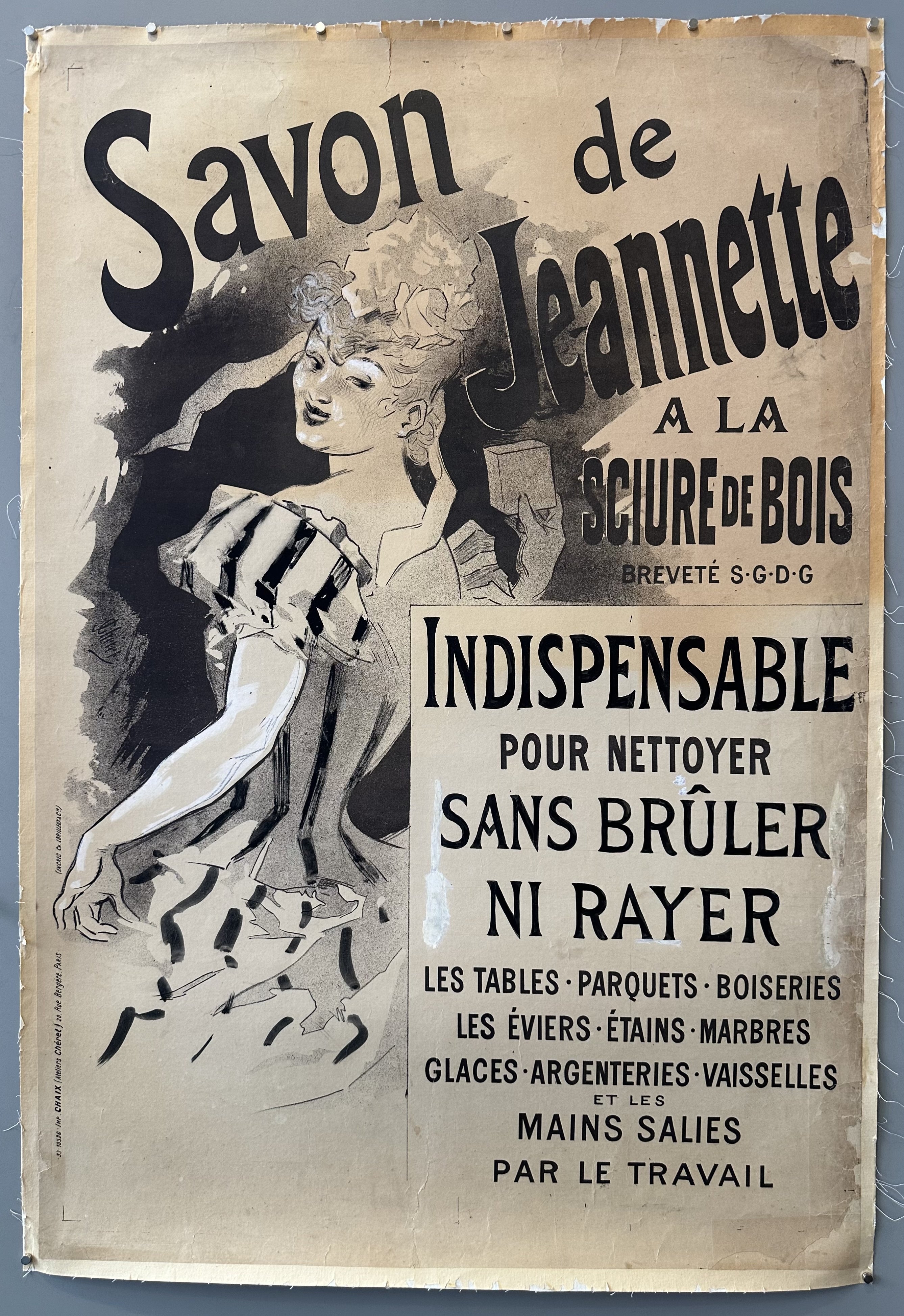 A vintage French advertisement for "Savon de Jeannette" (Jeannette's Soap) featuring a woman wearing a headscarf and holding a bar of soap.