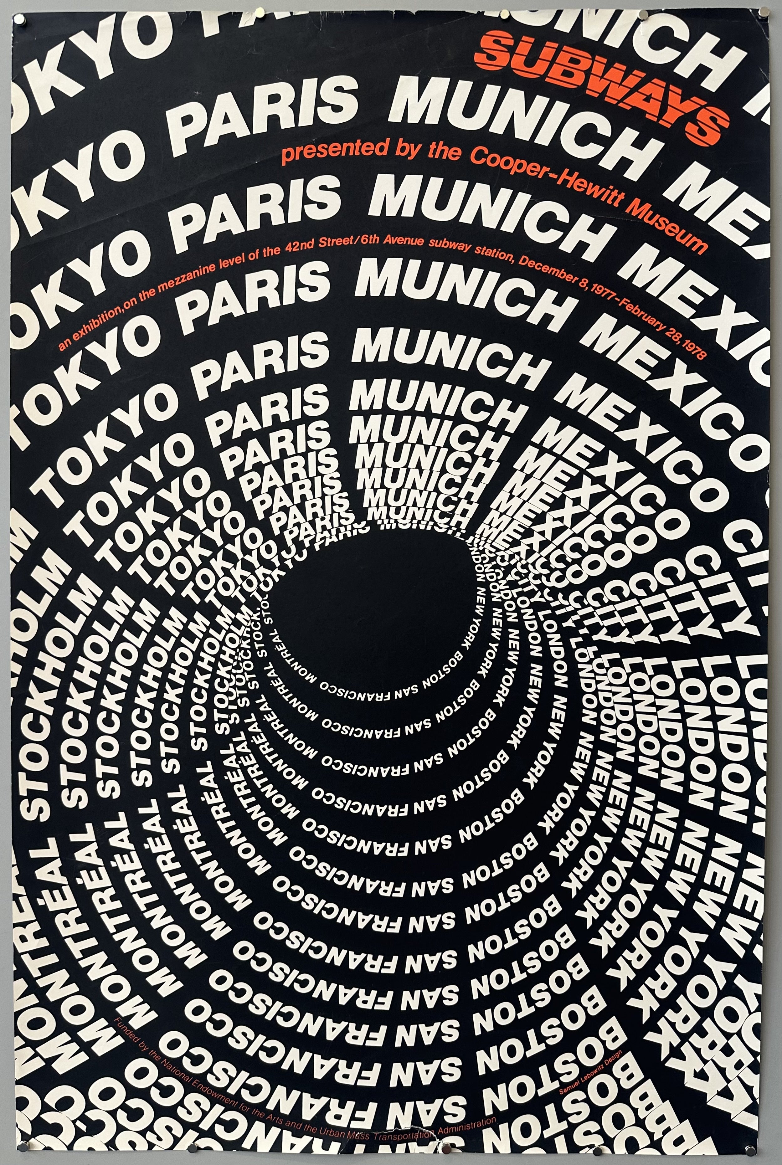 Black poster with white spiraling text of various cities.