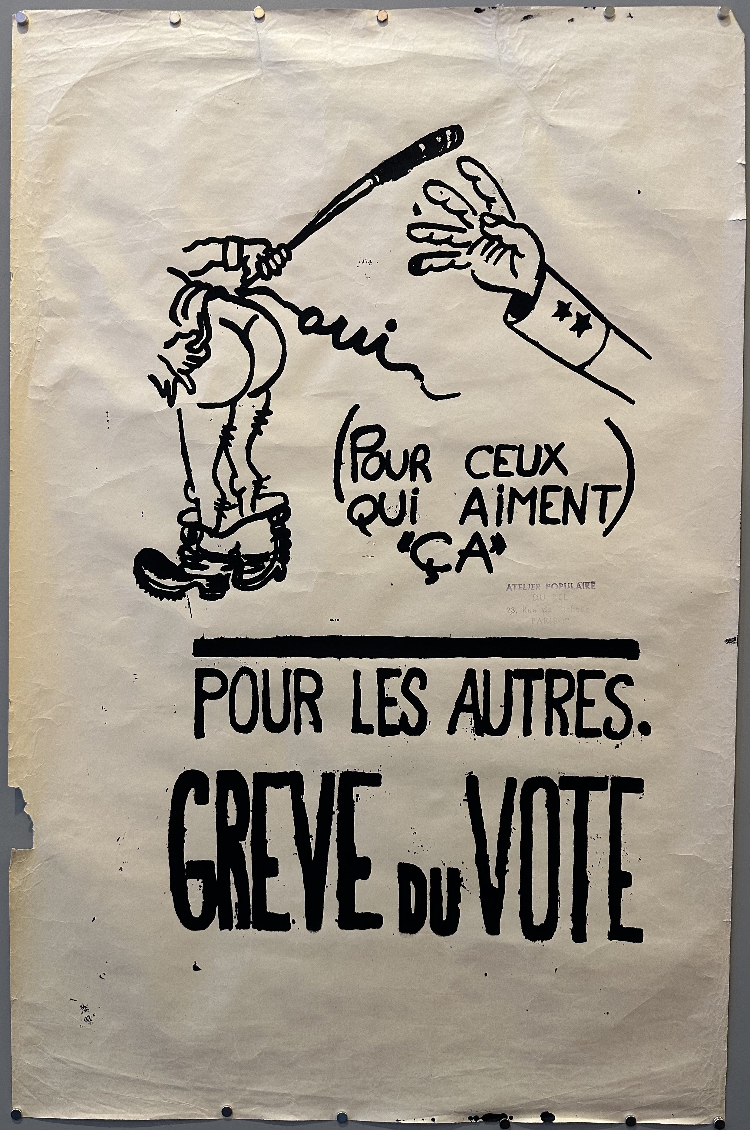 A cartoon character's pants are down and they are handing a police officer a baton in order to hit them in this satirical poster.