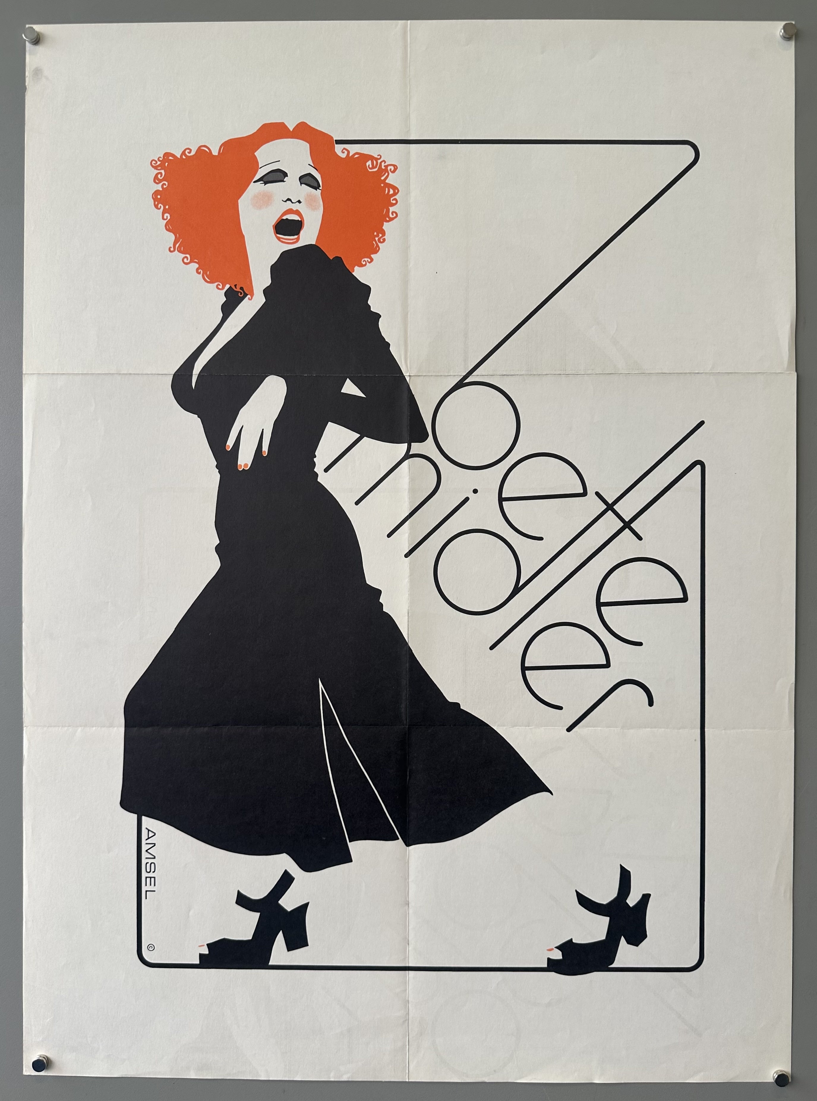 Black and white poster design of singer Bette Midler with the only color being her red hair in album insert design by Richard Amsel.
