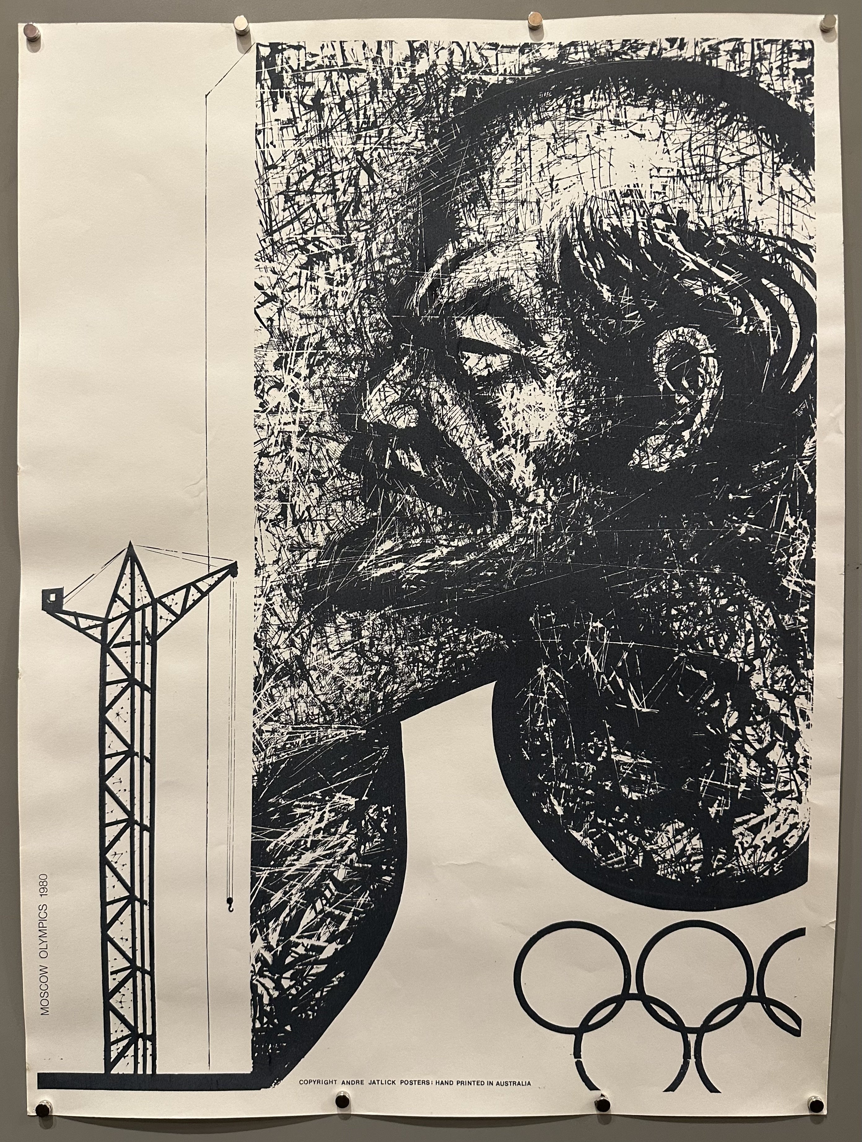 Black and white illustrated poster of a man's side profile and the Olympic rings below him for 1980 Moscow Olympics.