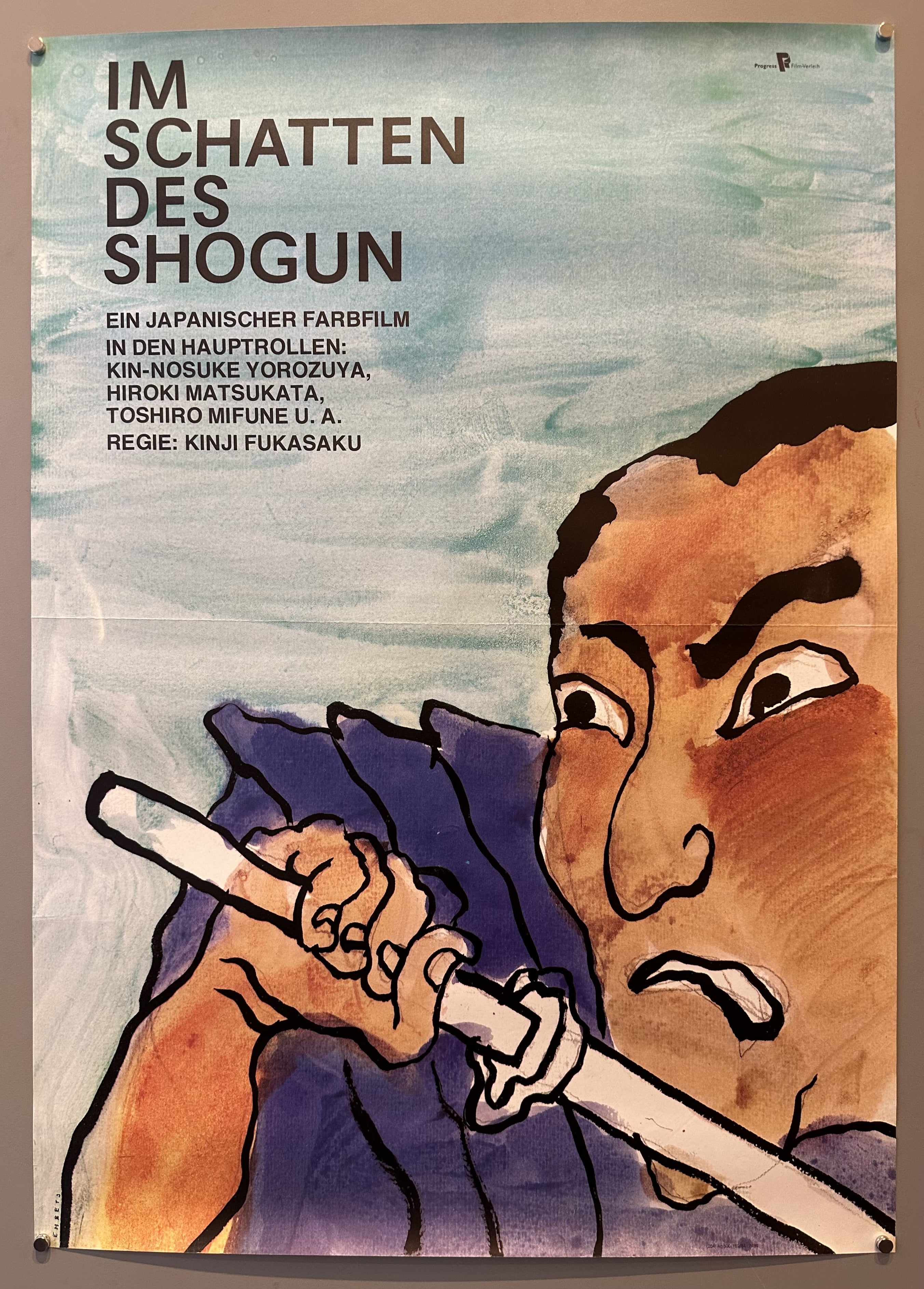 samari holding a sword with a fearful face with information on the film on the top left corner.