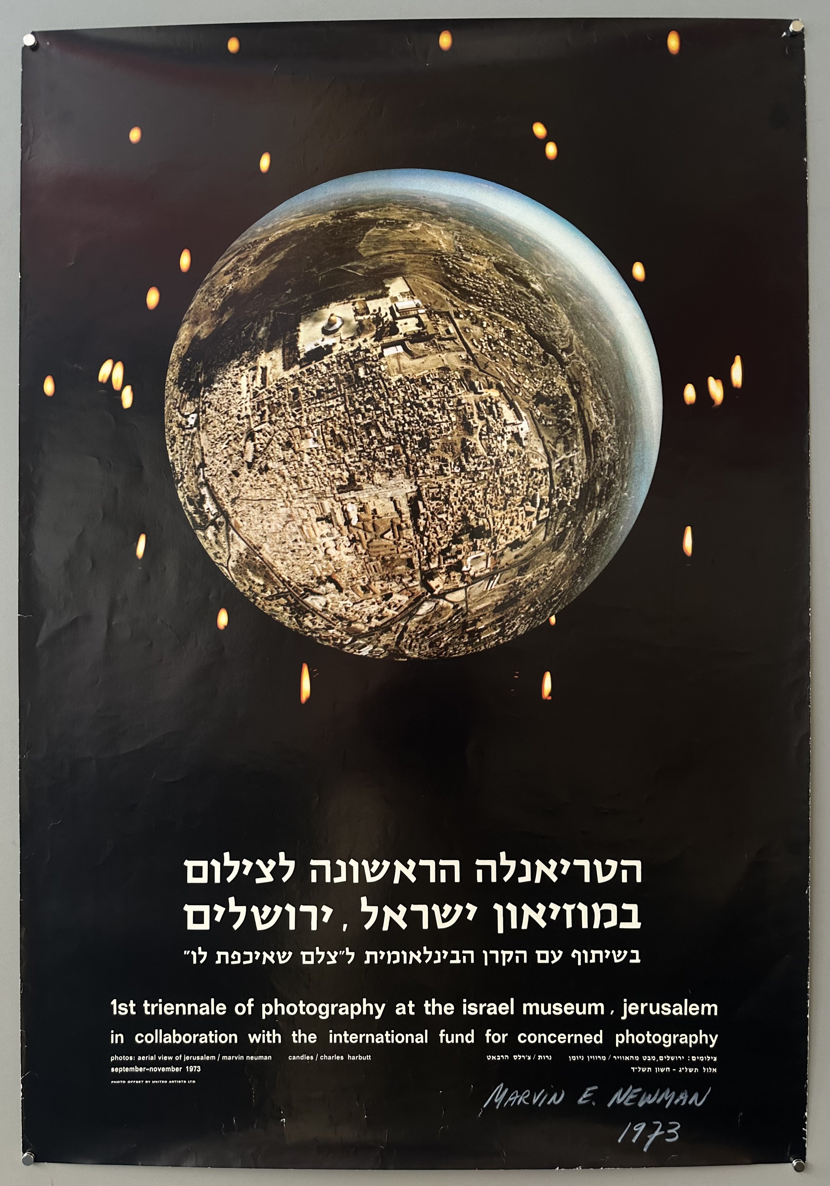 There is a centered sphere with an aerial view photograph of Jerusalem and the israel museum