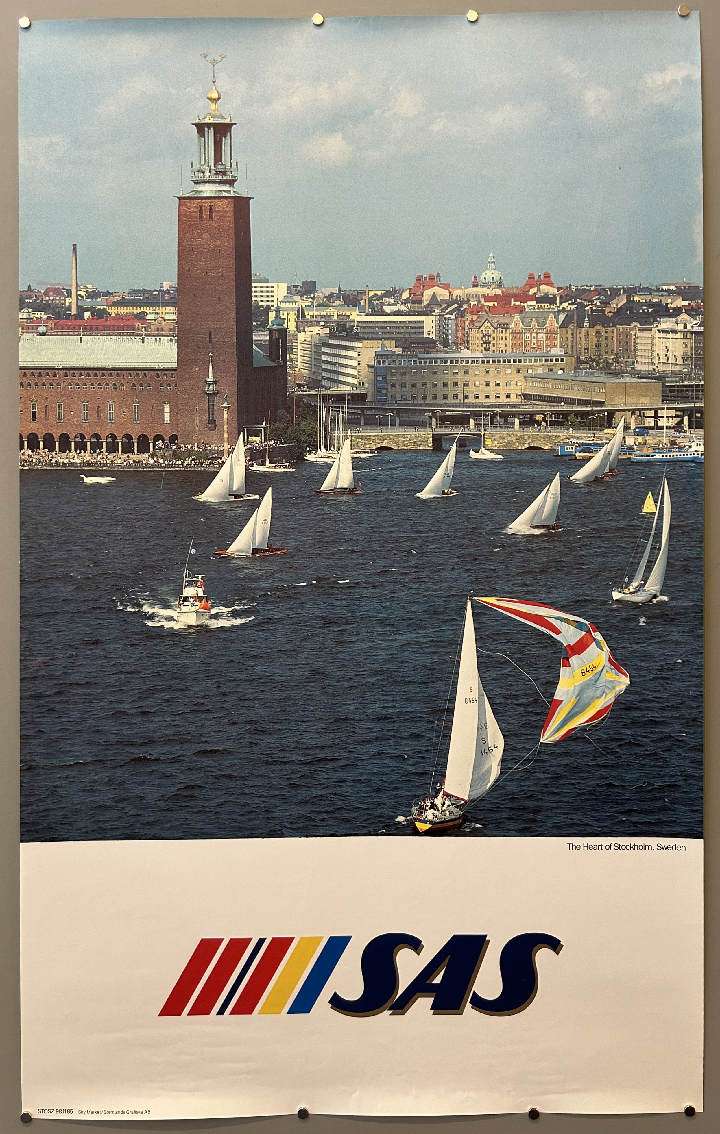 Photo of boats sailing in water in vintage travel poster from SAS, text is along bottom against white border.