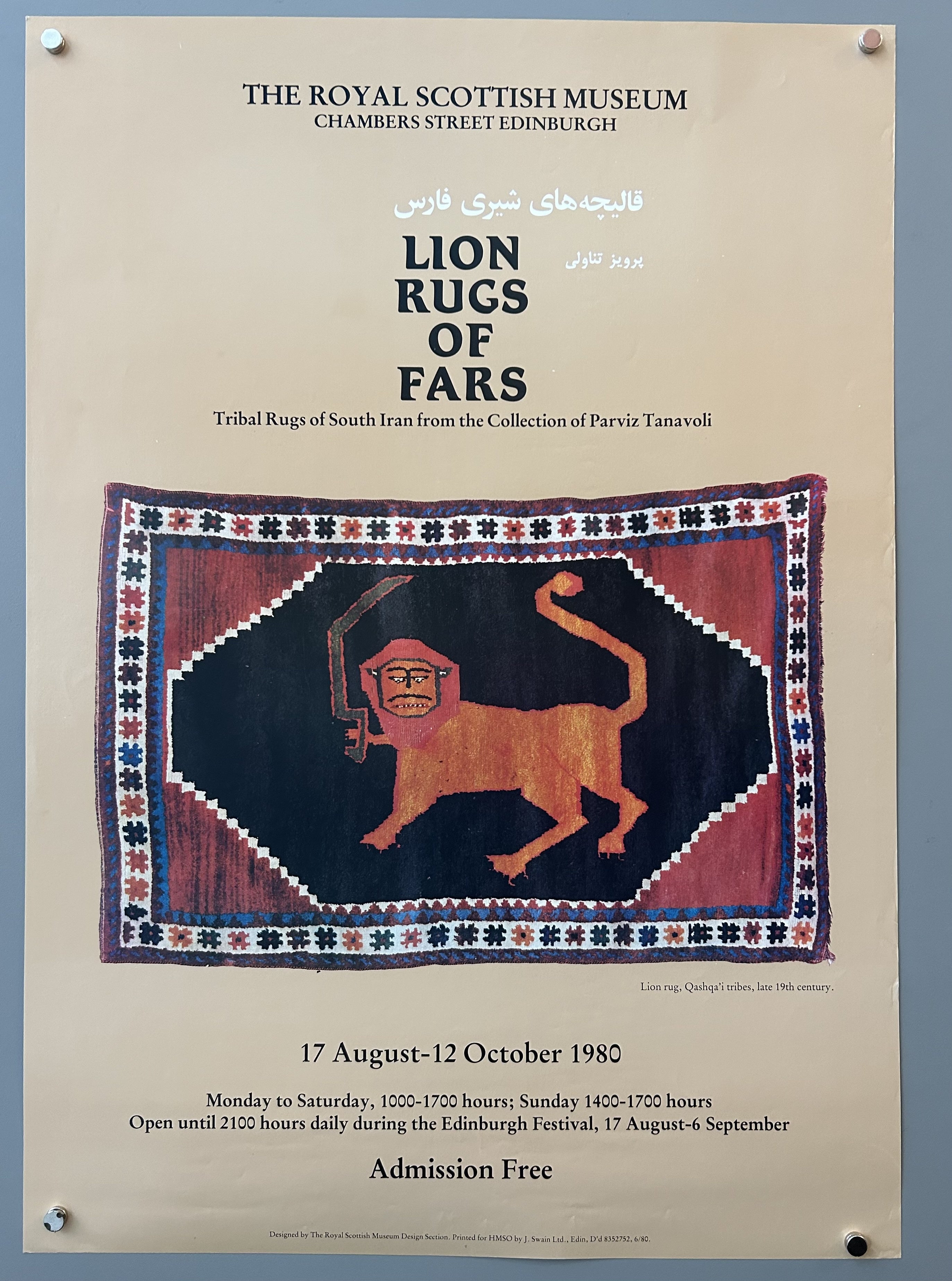 Beige poster with cut out photograph of an Iranian rug in the center; black text above and below image.