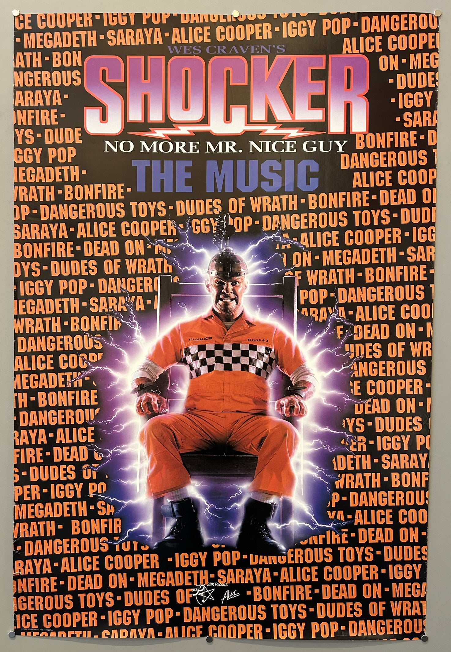 A promotional poster for "Wes Craven's Shocker: The Music" soundtrack from 1989, featuring a central image of Horace Pinker in an orange jumpsuit and checkered shirt, seated in an electric chair with glowing energy emanating around him. The poster is predominantly black with large, bold text in orange and white. "WES CRAVEN'S" is at the top, followed by the large title "SHOCKER" in orange. Below this, "NO MORE MR. NICE GUY" appears in white.