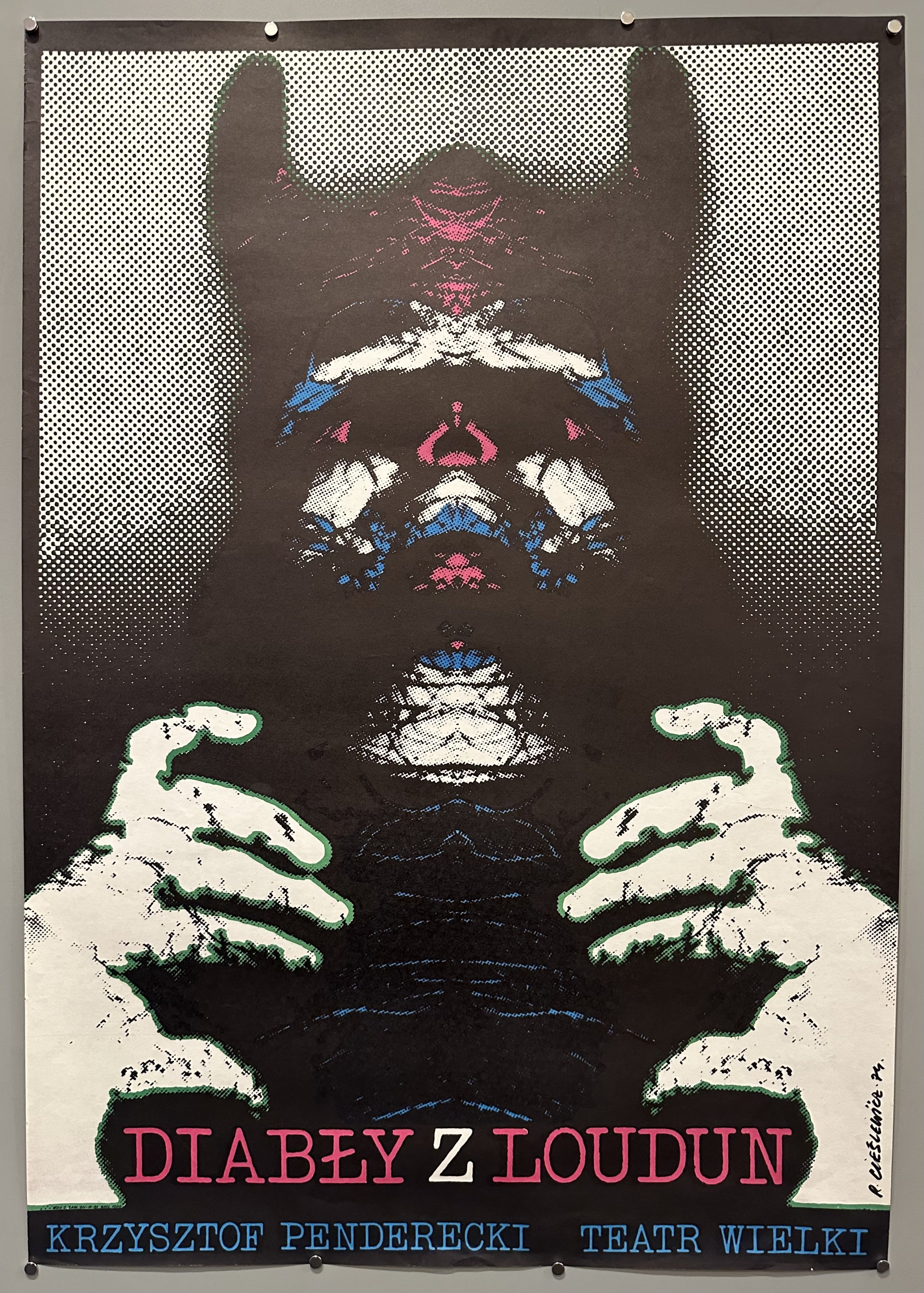 An unidentifiable creature is mirrored in this Polish theater poster.