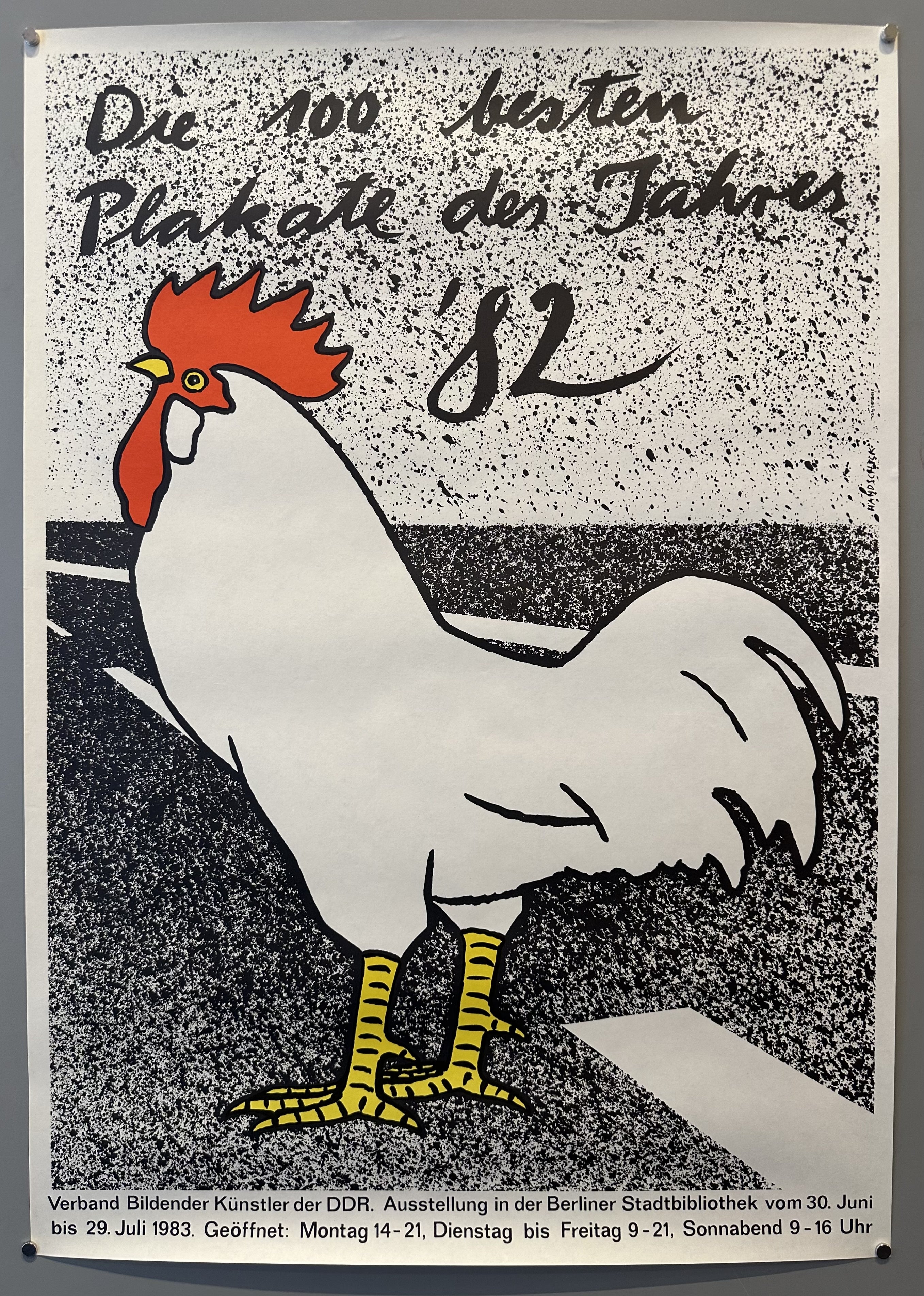 A poster advertising an exhibition of the 100 best posters of 1982 in East Germany. The poster features a white rooster with German text providing details about the exhibition.