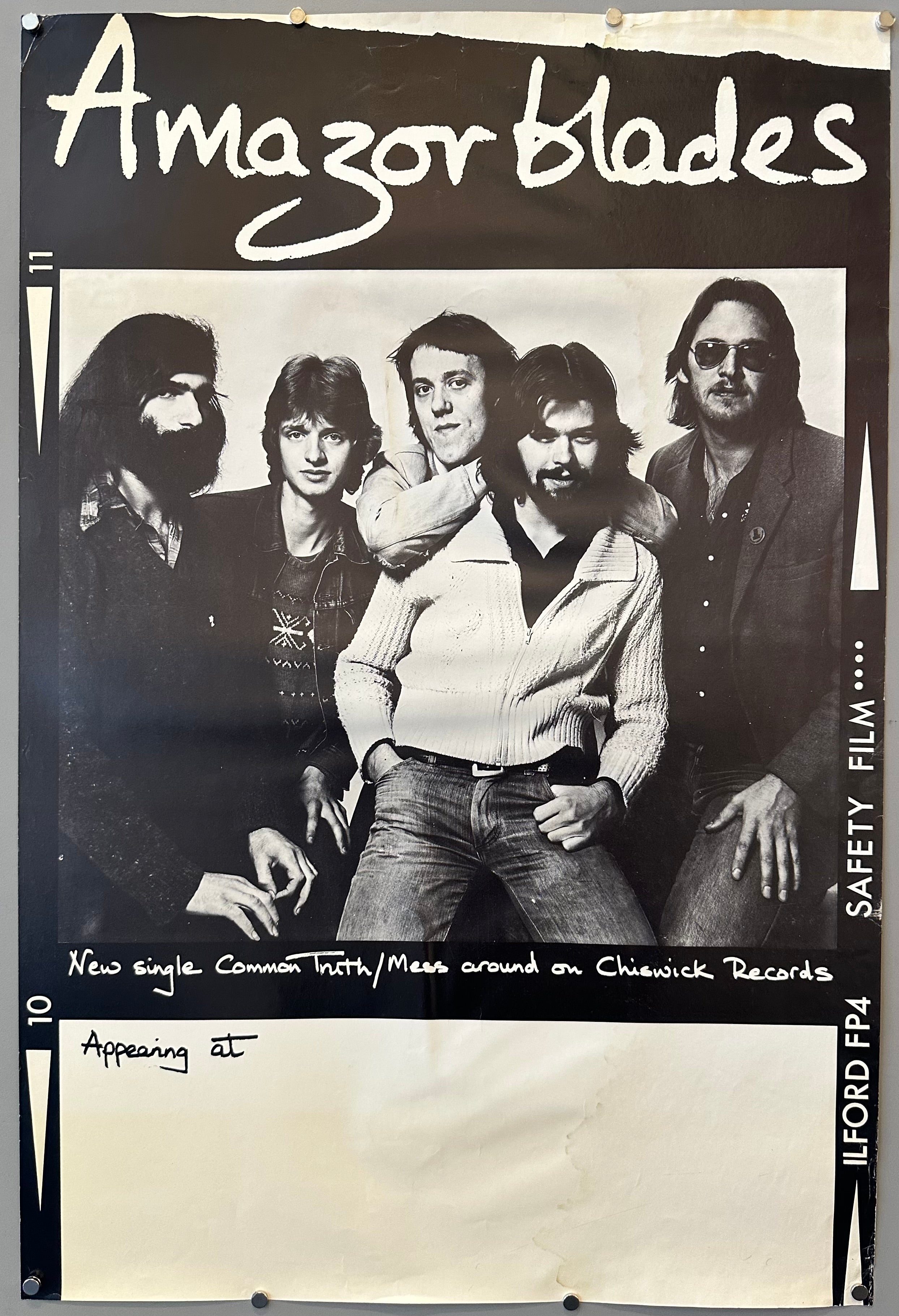 This poster was designed to resemble a film poster, complete with a space to fill in where the band would be appearing next.