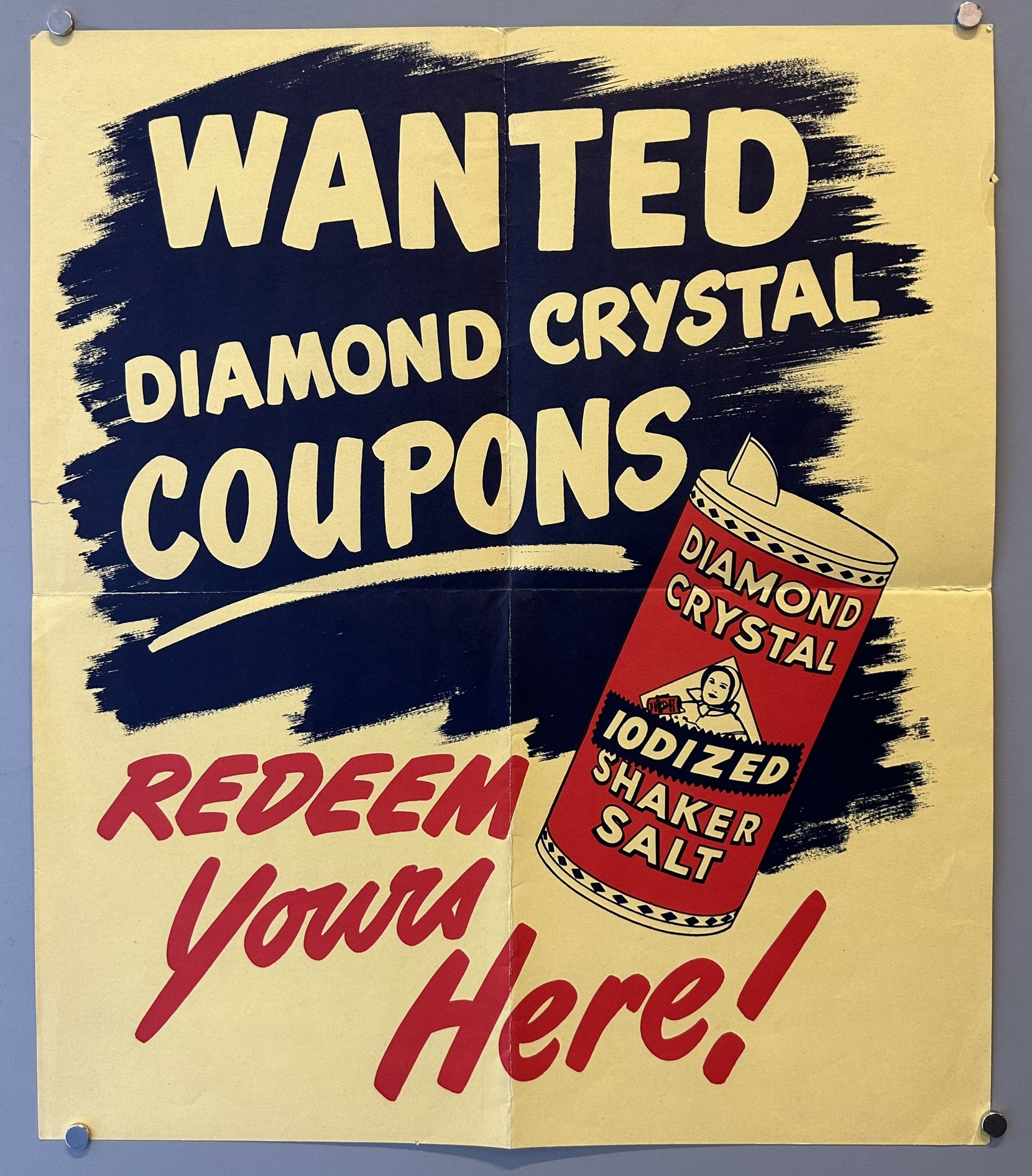 Yellow background with a dark blue painted swatch with words inside saying "Wanted Diamond Crystal Coupons" An image of Diamond Crystal Iodized shaker salt. At the bottom there is wording in red stating "Redeem Yours Here!"