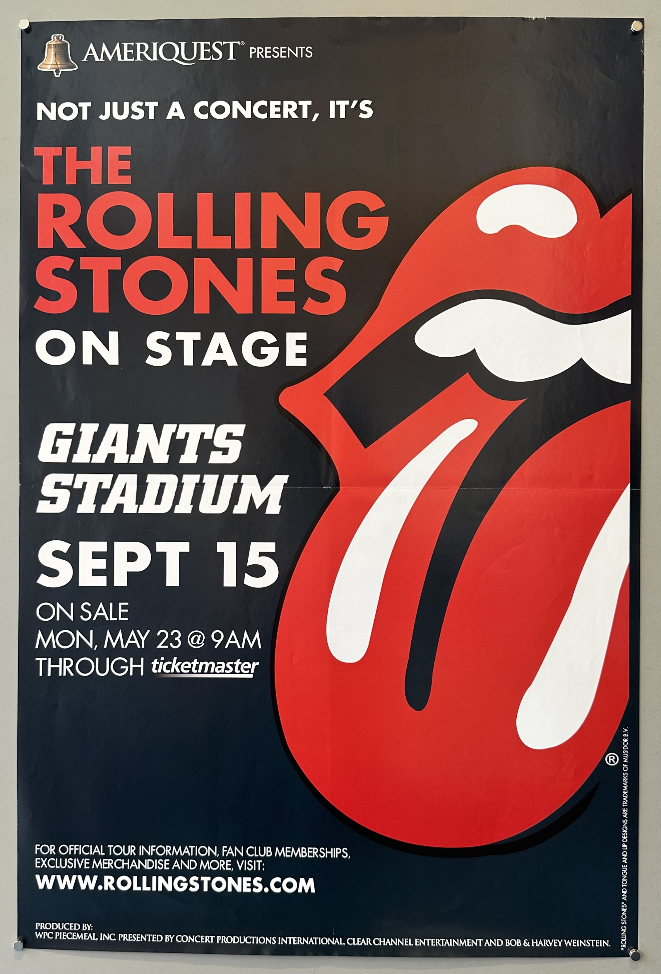 Lips and tongue imagery from Rolling Stones next to white and red text against black background for promotional imagery.