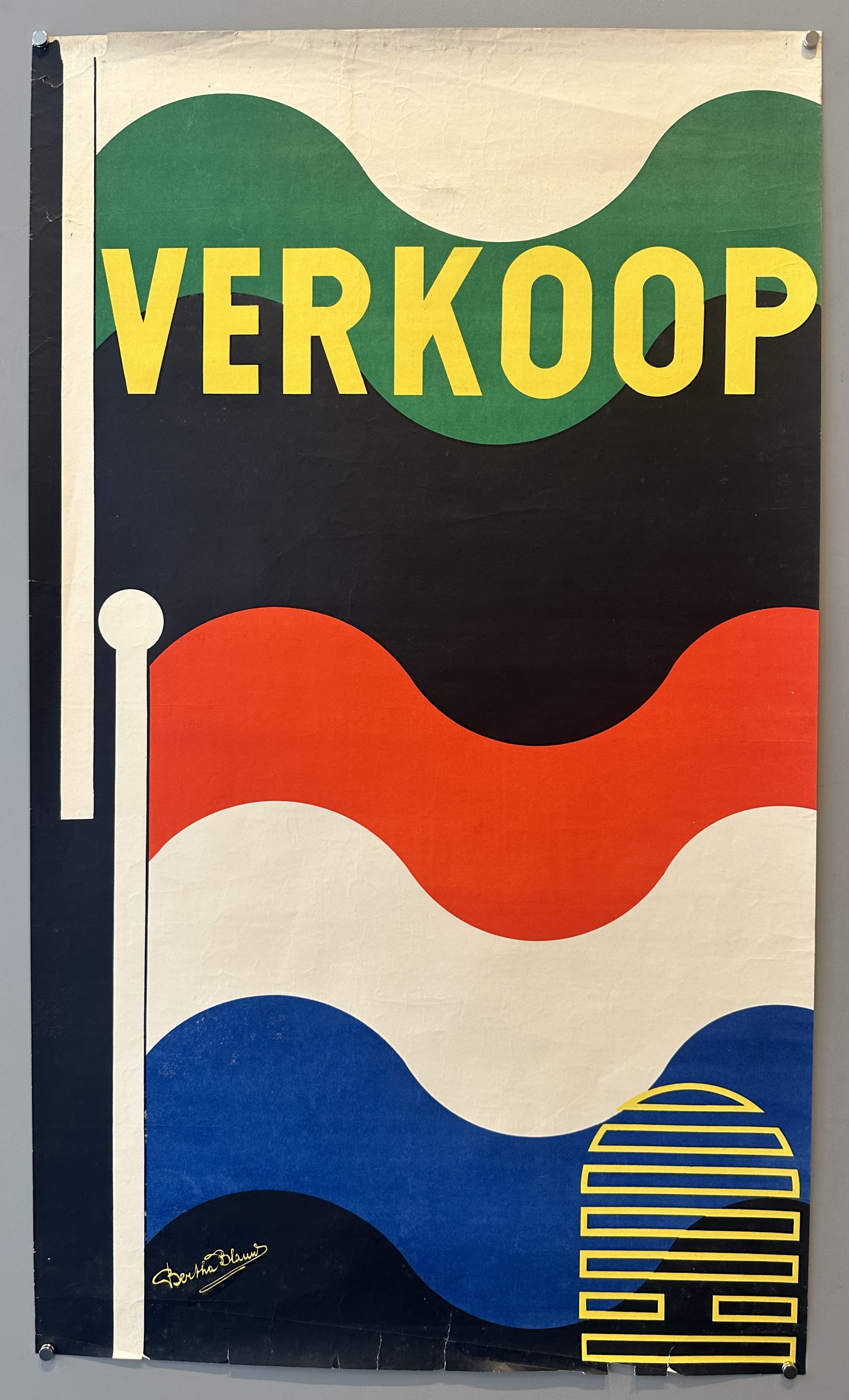 The word "VERKOOP" is featured in Dutch, with a background transitioning to a flag-like design with wavy colorful stripes.