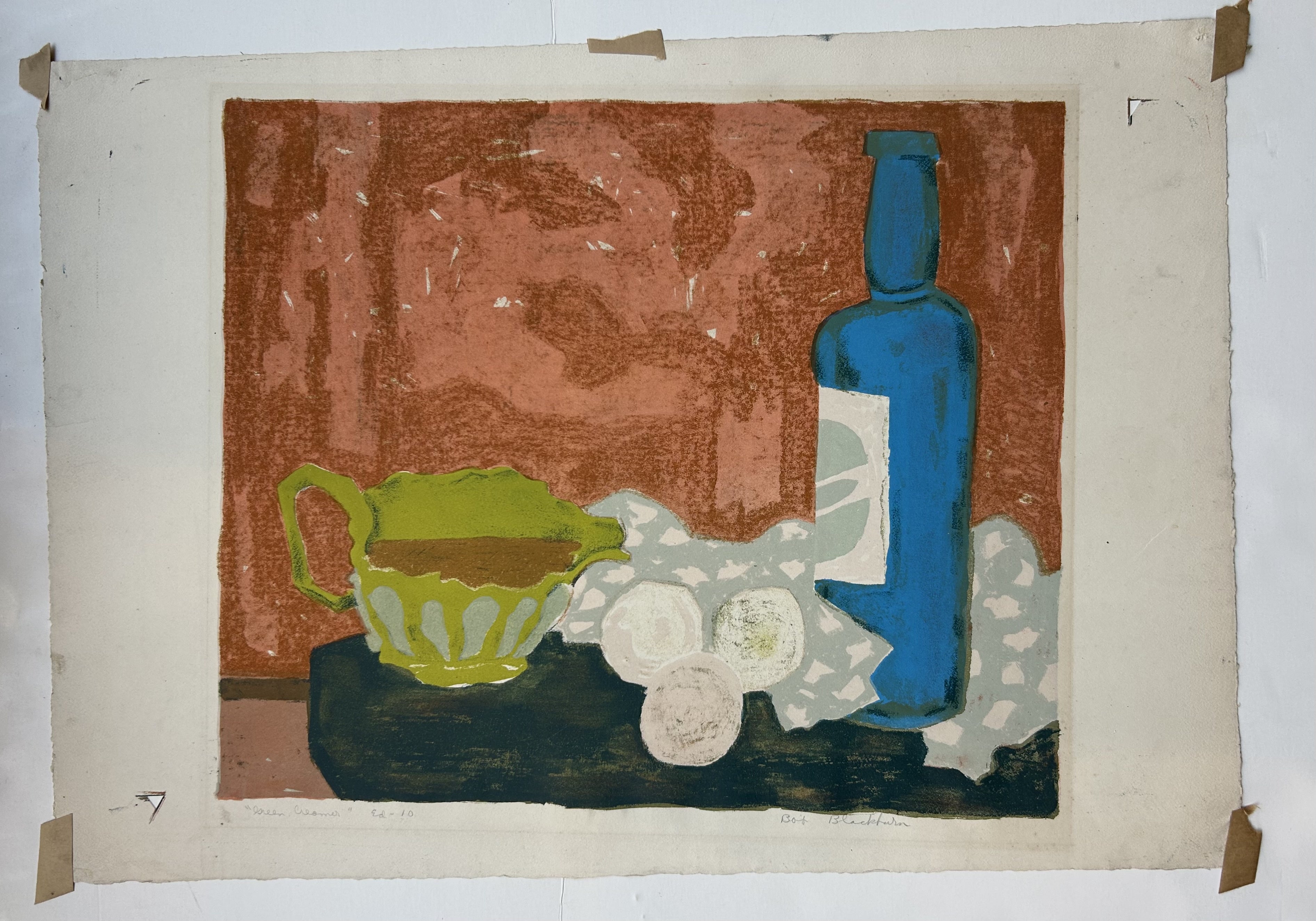 Still life of wine bottle and cream