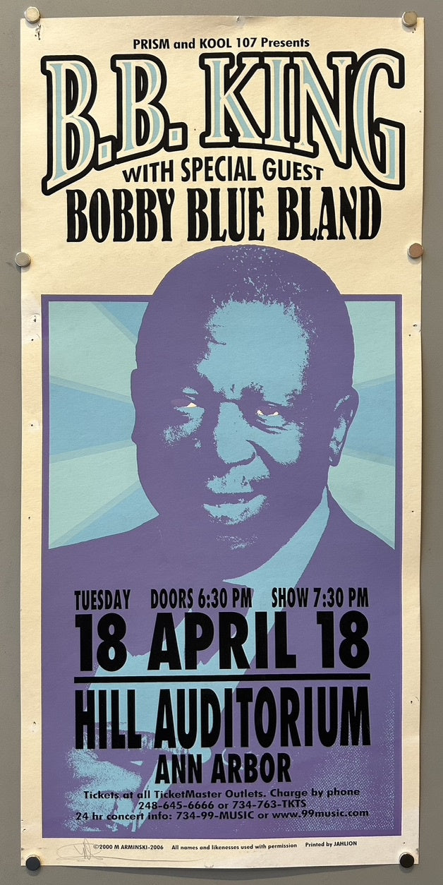 A concert poster for B.B. King with special guest Bobby Blue Bland, presented by PRISM and KOOL 107. The poster features a purple-hued portrait of B.B. King in the center. Below the portrait, concert details are listed: