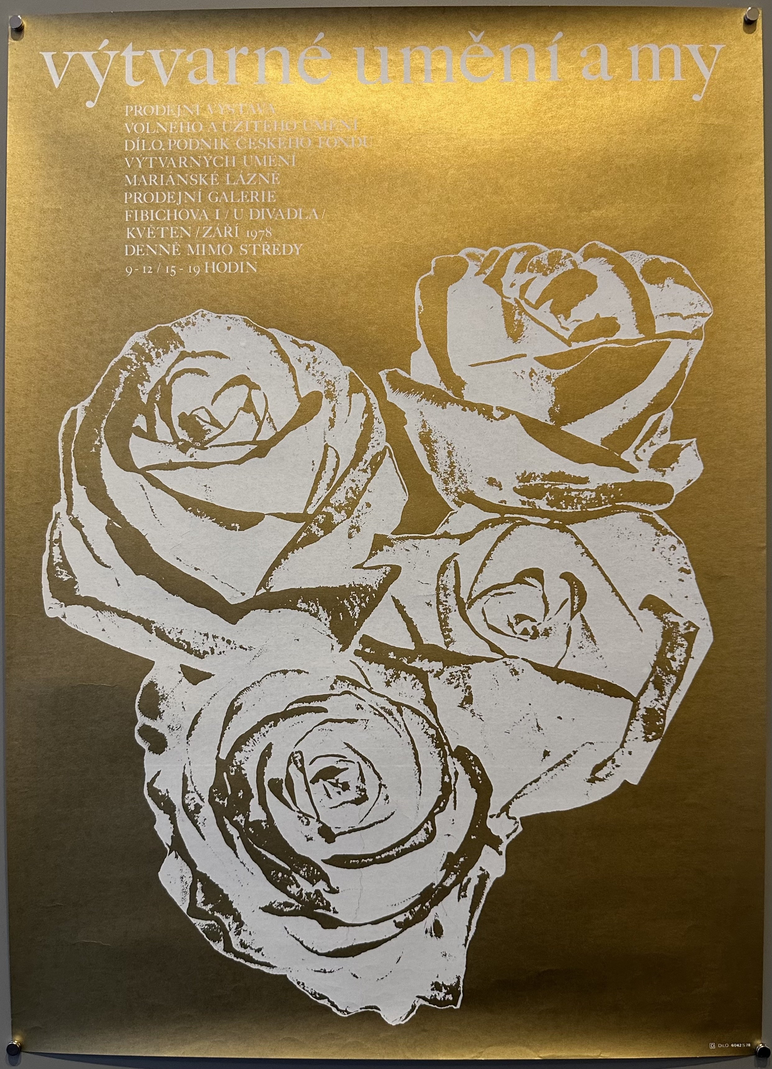 Gold reflective poster with four white roses outlined in the middle and white text above them promoting a visual arts exhibition in Czechoslovakia.