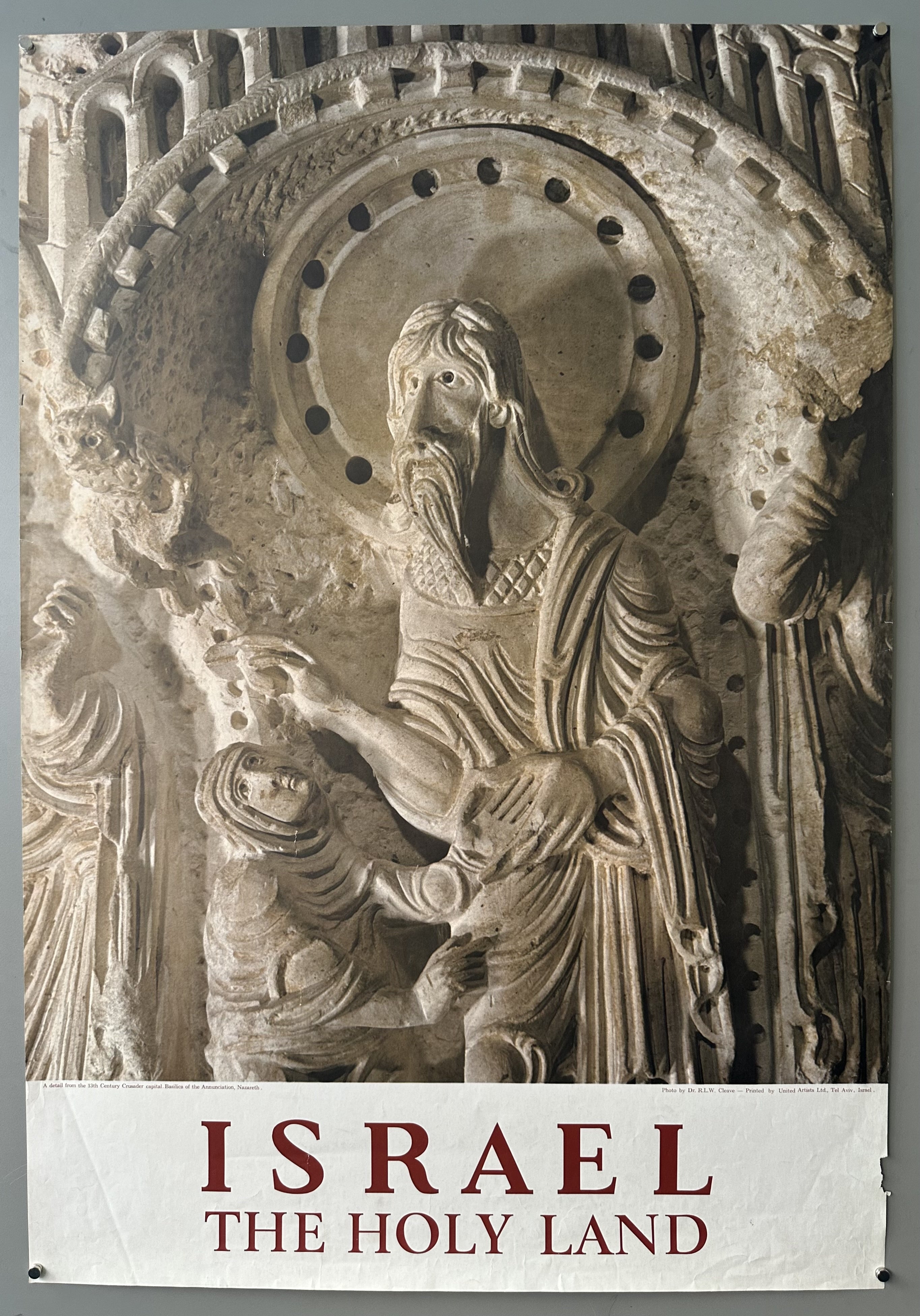 There is a sculpted jesus that seems to be hovering his right hand over a persons head next to him.