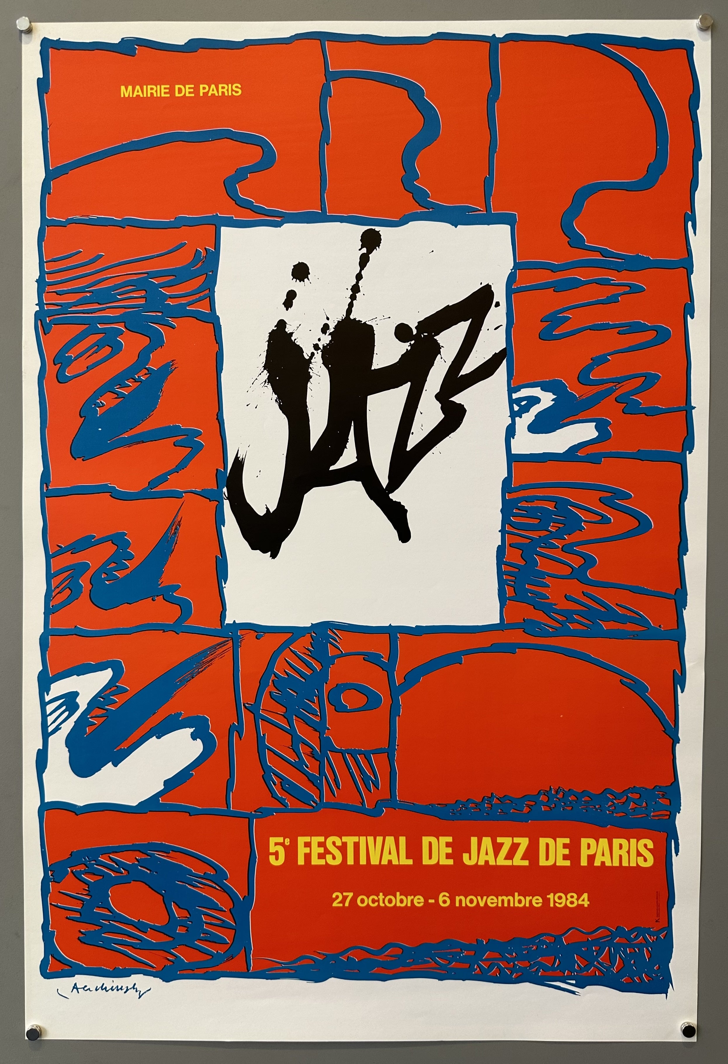 Red and blue poster with grafitti-style typography promoting a jazz festival in Paris.