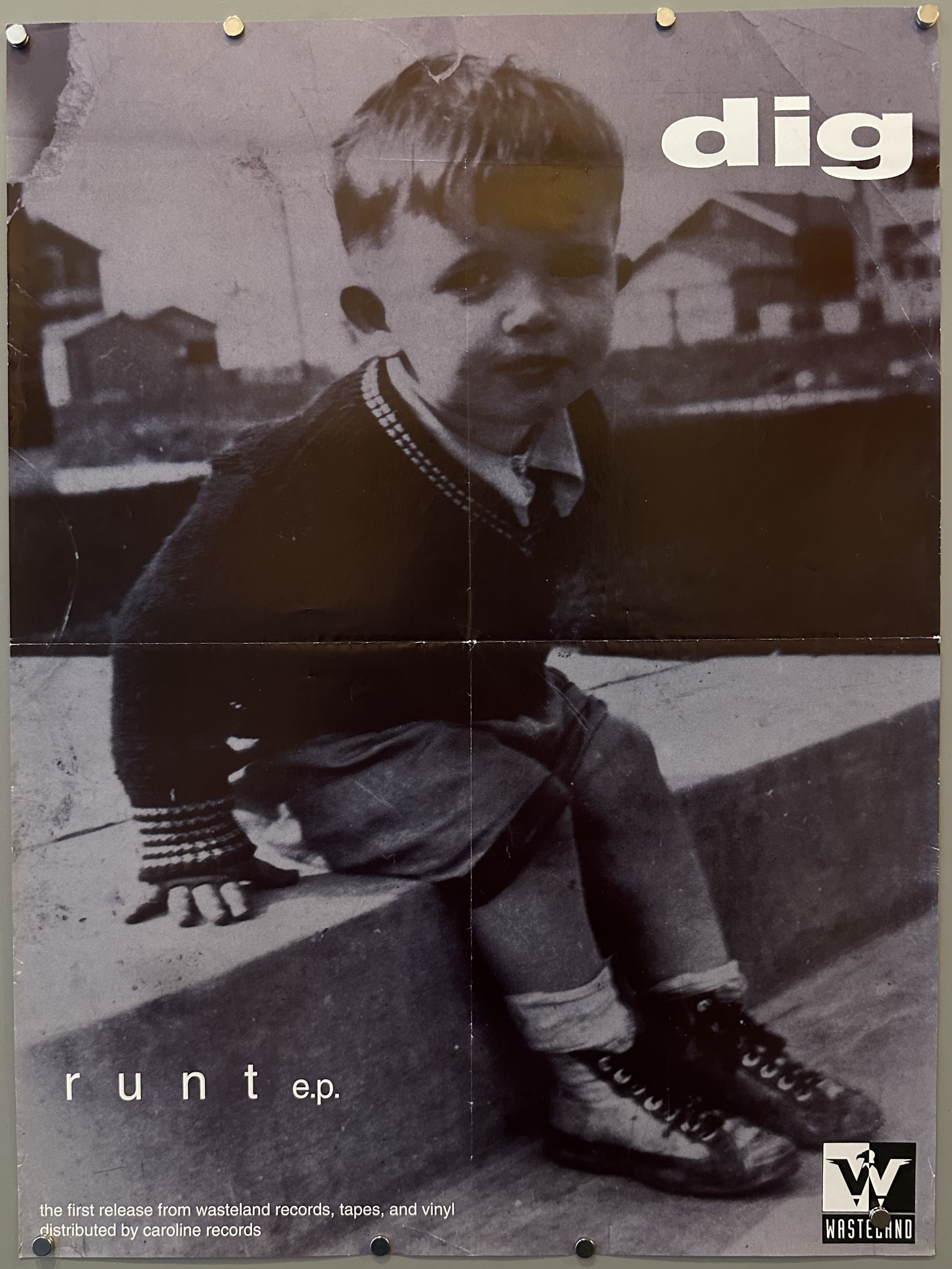 Black and white photograph of a small boy with white text for album release by Dig.