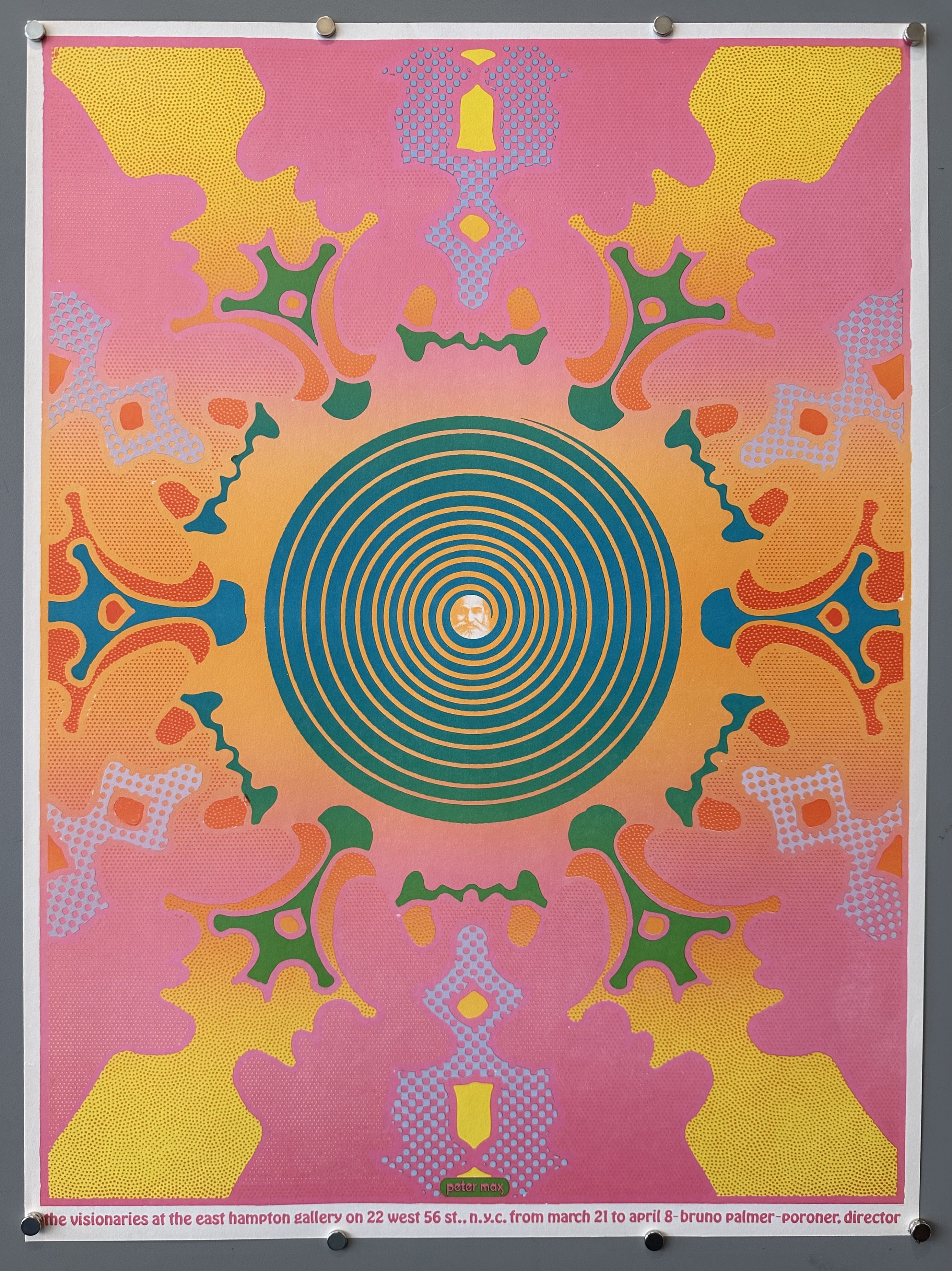 Psychedelic style poster designed by Peter Max for an art exhibition, with hypnotic circle in the middle with a man's face.