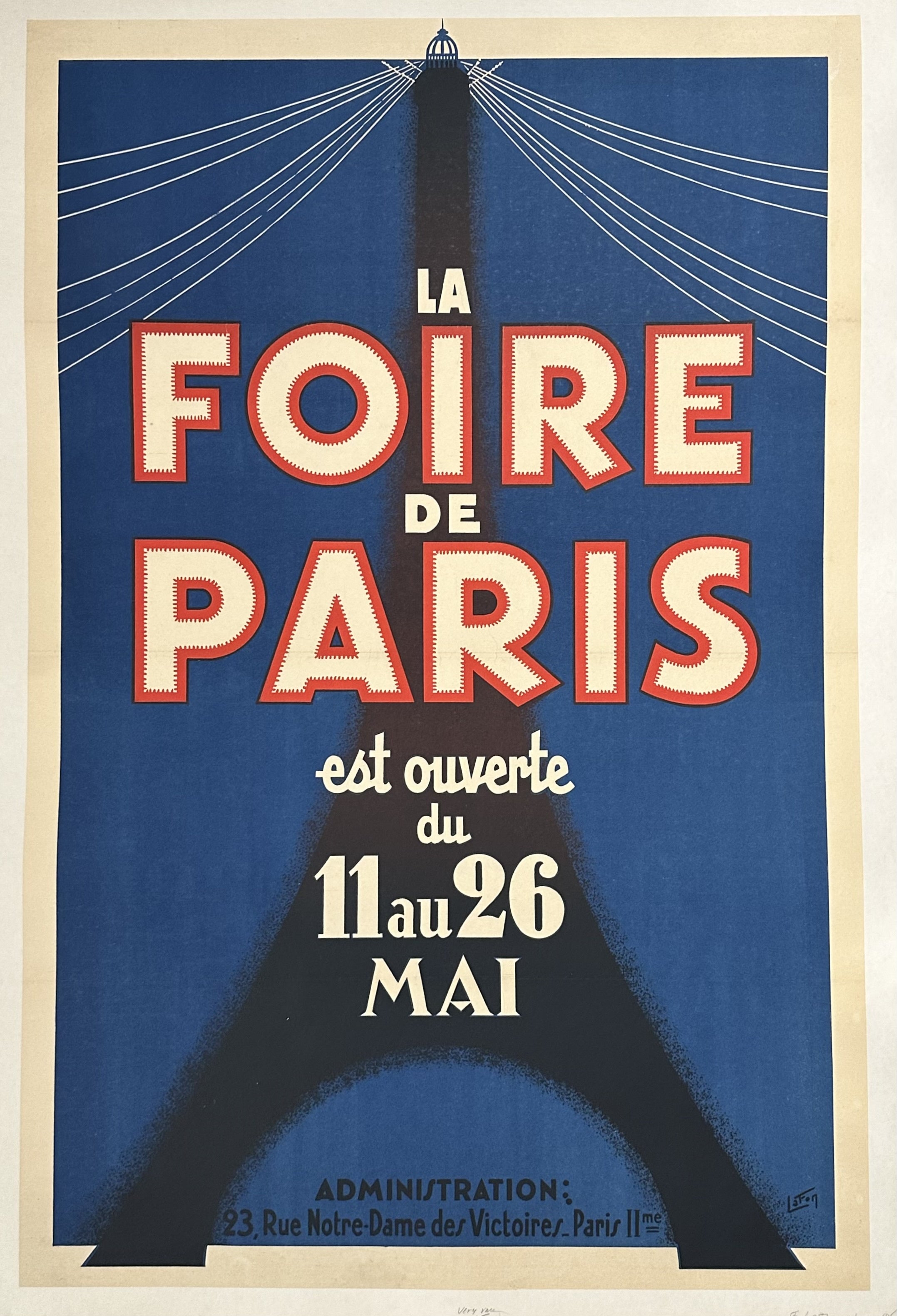 Predominantly dark blue poster with black outline of Eiffel Tower and red and white text over top to promote La Foire de Paris.
